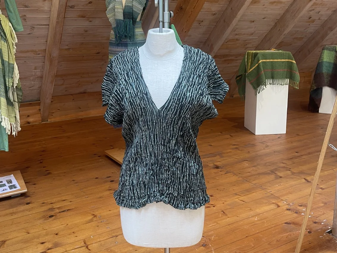 A hand-woven silk top on exhibition