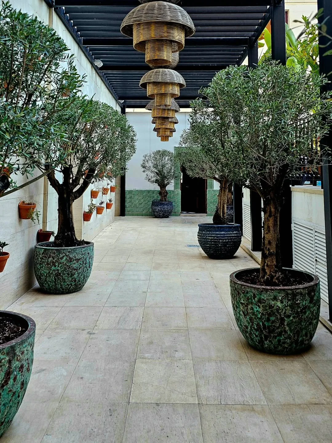 Summer&rsquo;s not over yet, even if it feels like we&rsquo;re living through all four seasons in one day. 
Let&rsquo;s talk about designing an outdoor space that works, rain or shine. A pergola is a great place to start. On sunny days, it offers sha