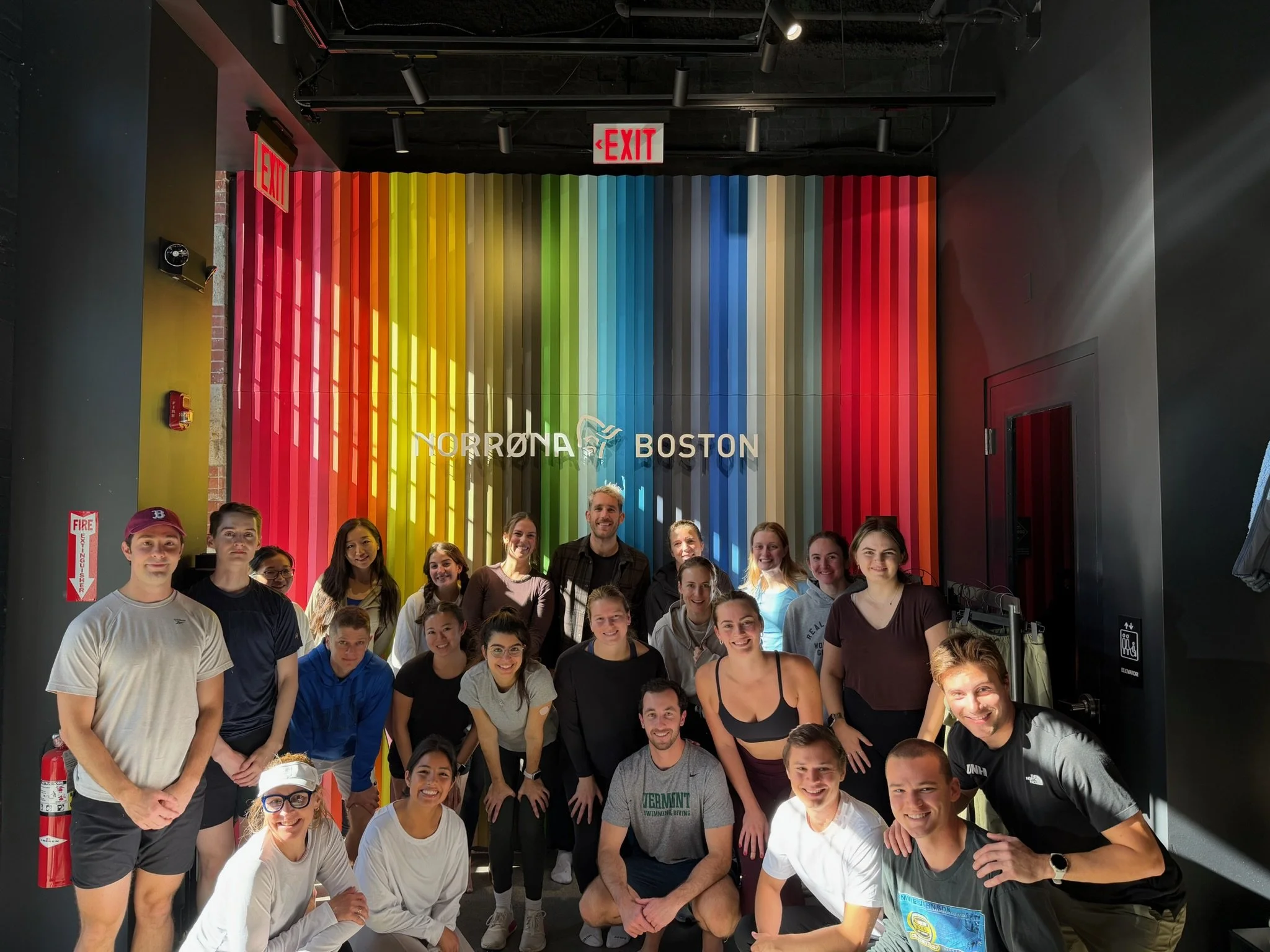 A group picture after a free yoga for runners event at Norrona on Newbury street. A great idea for things to do in Boston to meet other like-minded people.