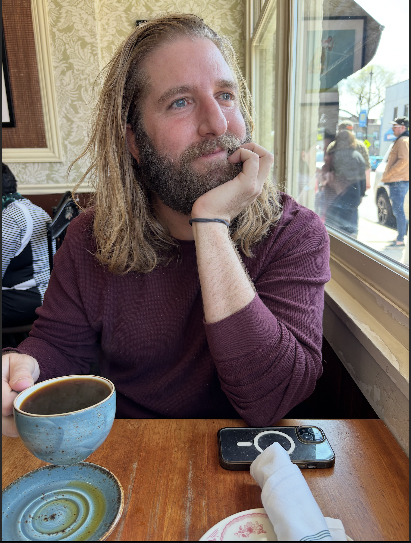 A photo of Brian Moody in a coffee shop.