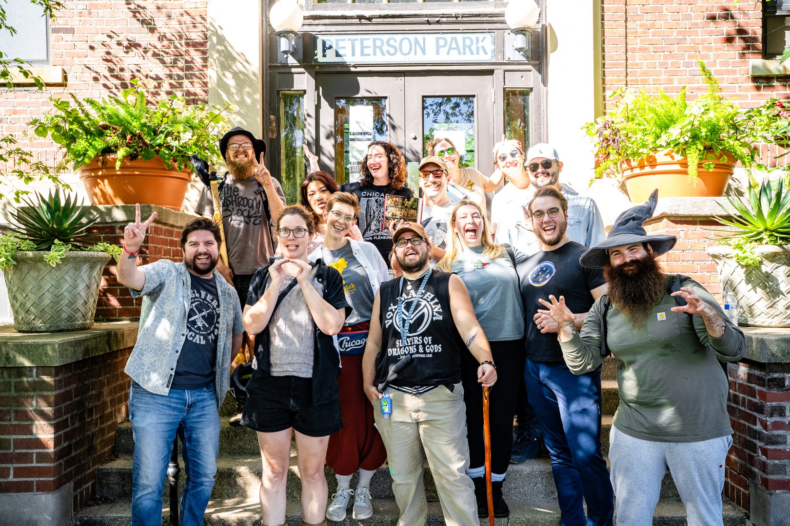 A group photo of the CTGA and friends on a mushroom walk, in front of the Peterson Park building.