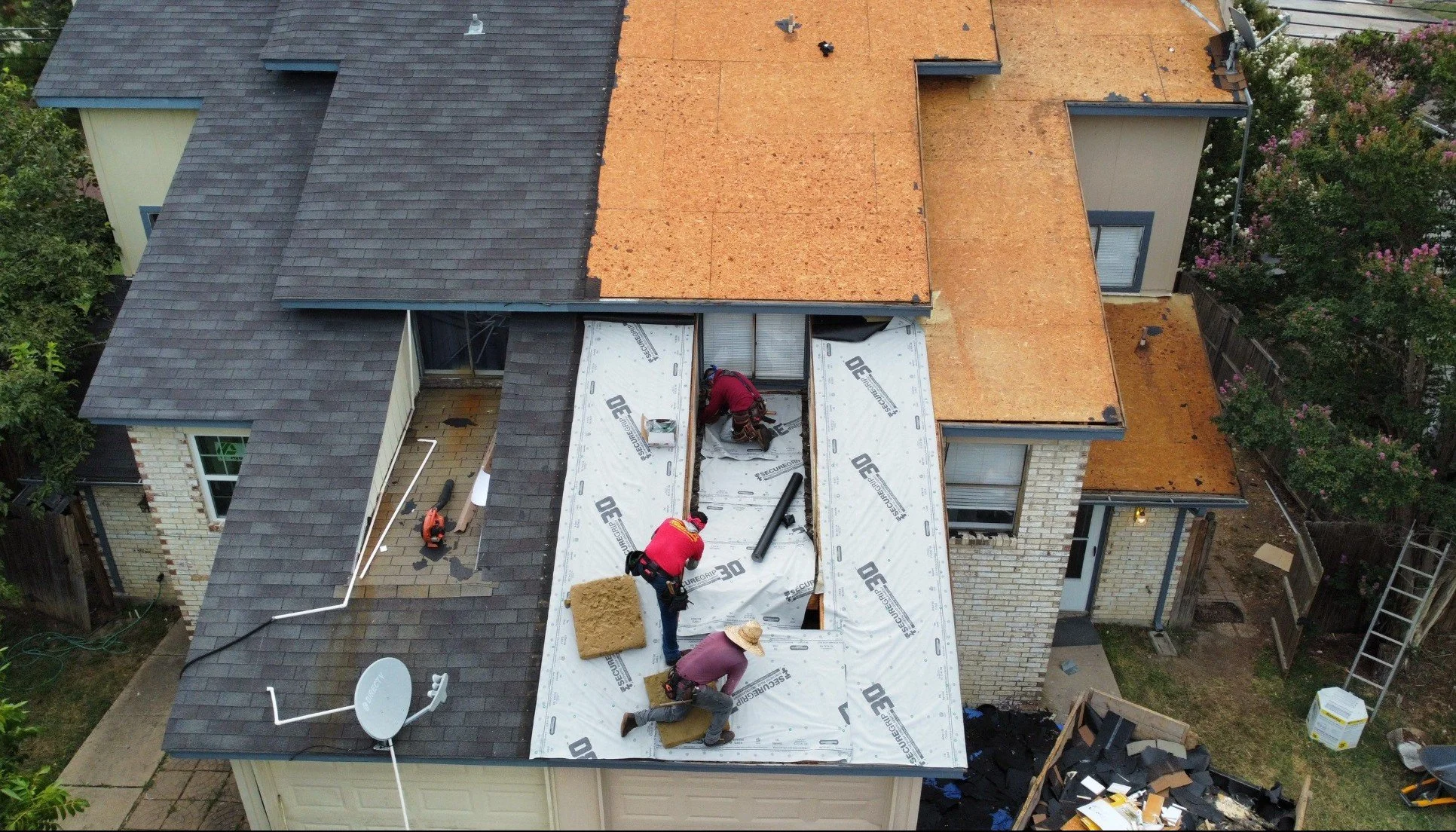 True Bond Roofing crew working on a residential roof replacement in Grand Prairie, TX.