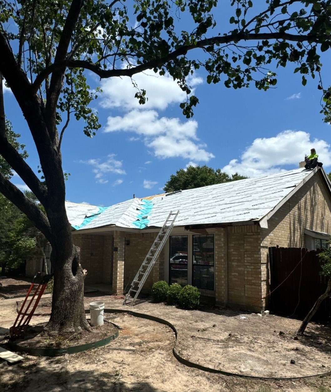 True Bond Roofing crew working on a residential roof replacement in Coppell, TX.