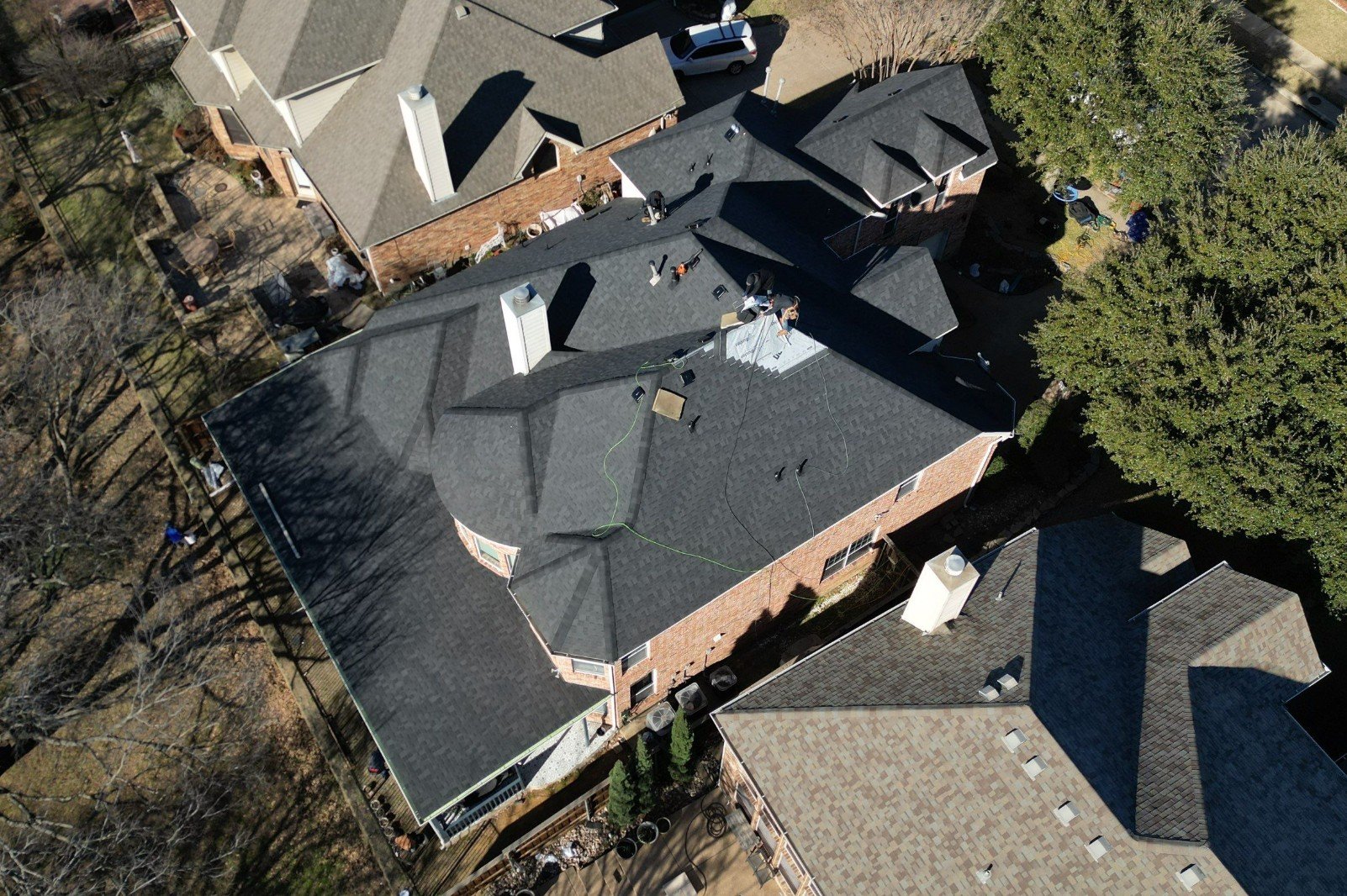 Aerial view of a residential roof replacement in progress by True Bond Roofing in Euless, TX.