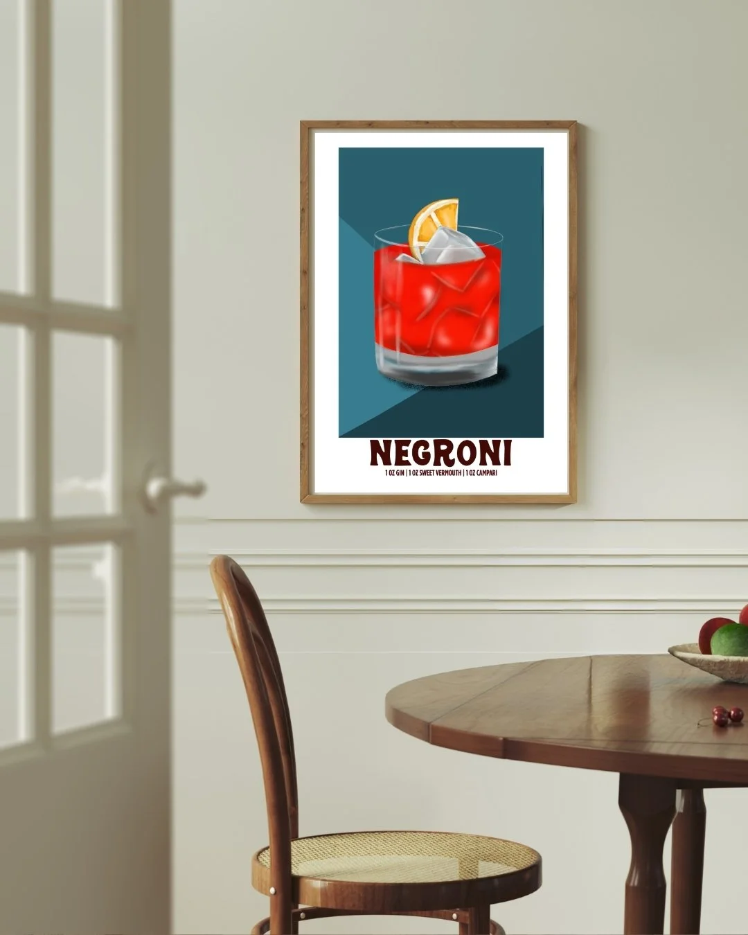 Negroni cocktail art print styled above a home bar cart