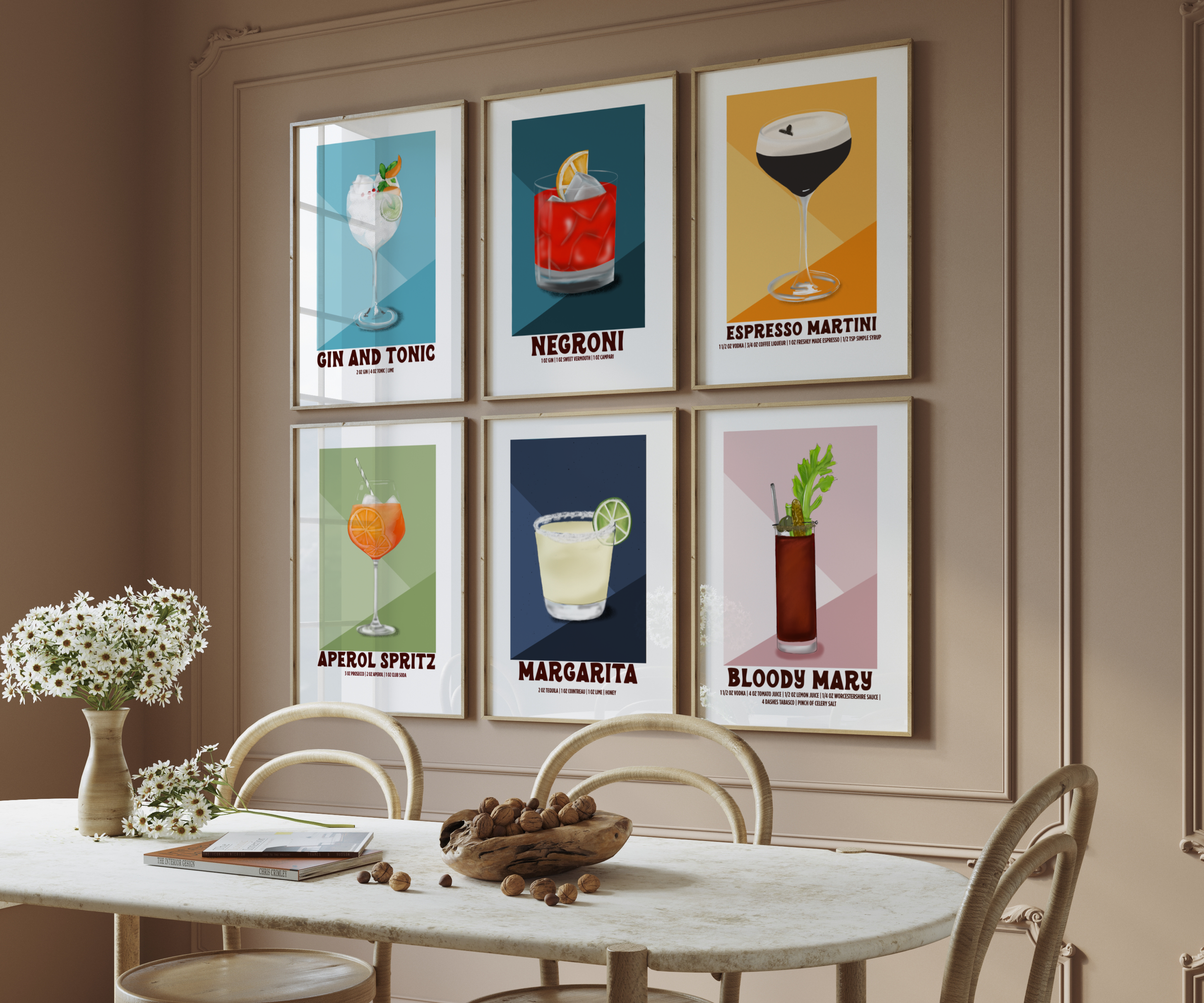 Gallery wall of illustrated cocktail prints including the Gin & Tonic