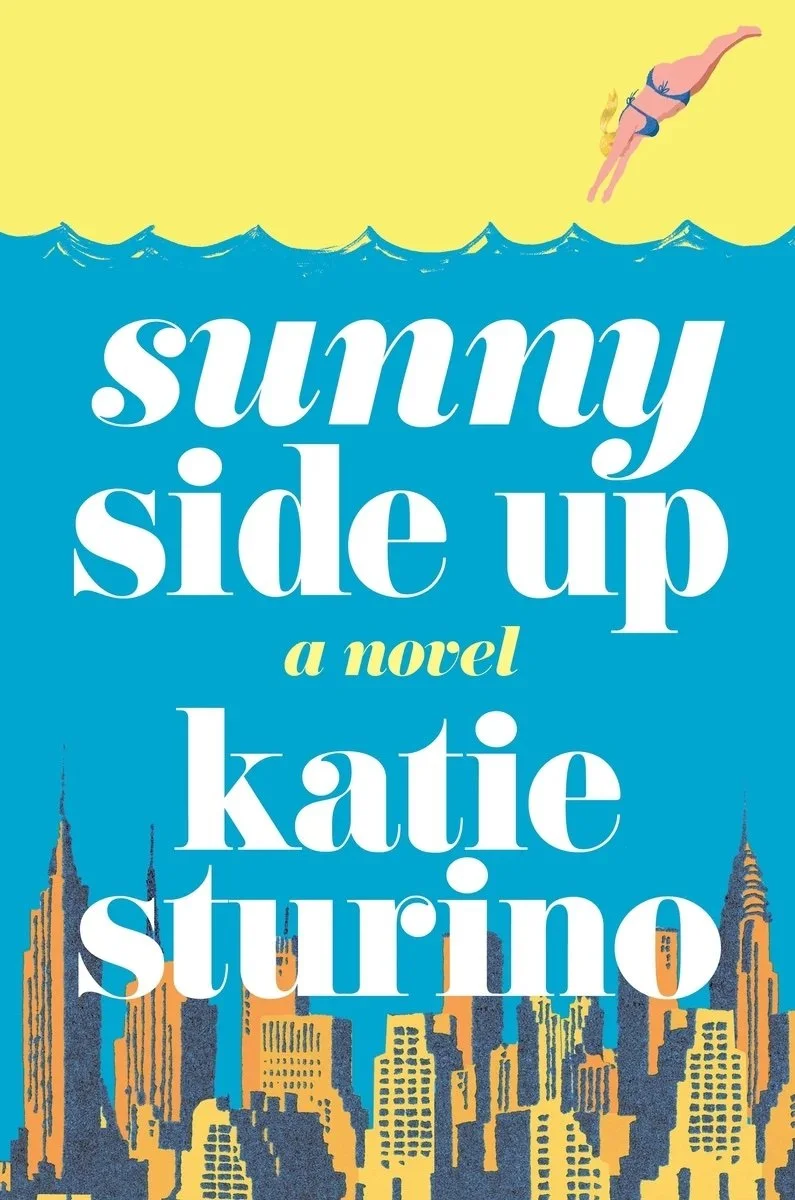 Book cover of Sunny Side Up by Katie Sturino featuring bold white text on a bright blue and yellow background with an illustrated swimmer diving into waves and the New York City skyline.