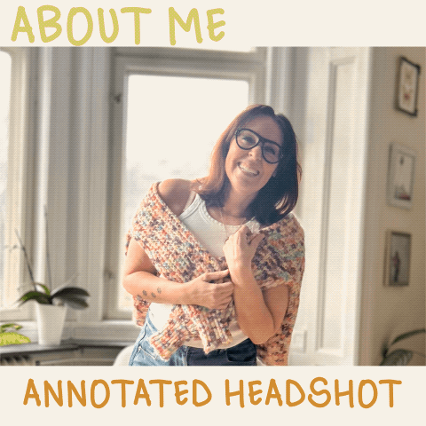 Woman smiling indoors wearing glasses and a shawl draped over her shoulders, standing in front of a window. Text overlay reads 'About Me Annotated Headshot.'