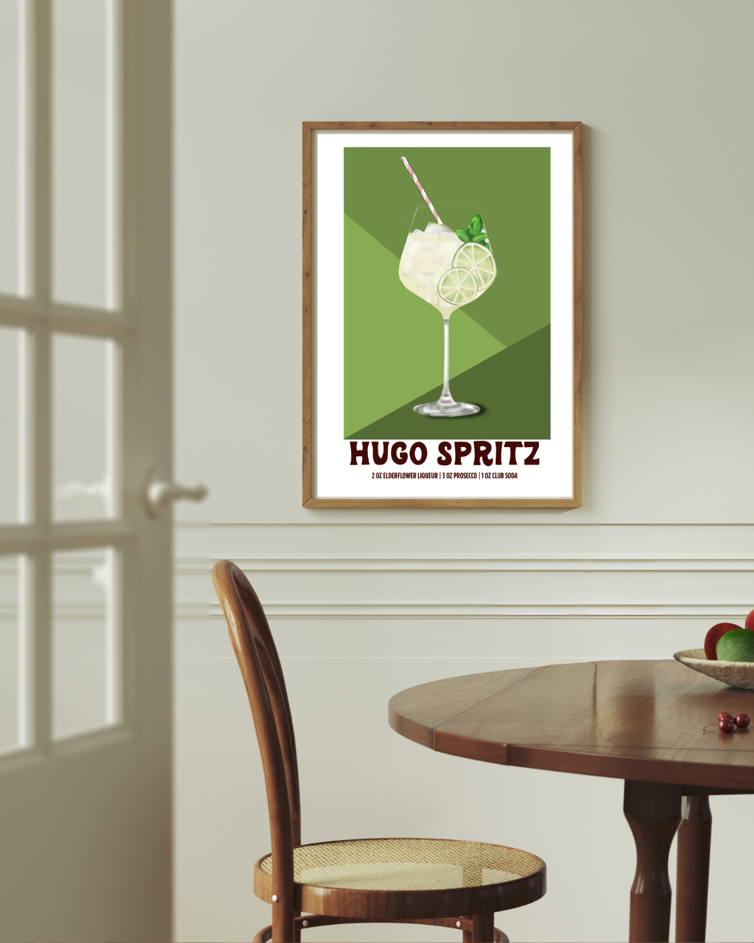 Hugo Spritz cocktail art print styled above a dining room table