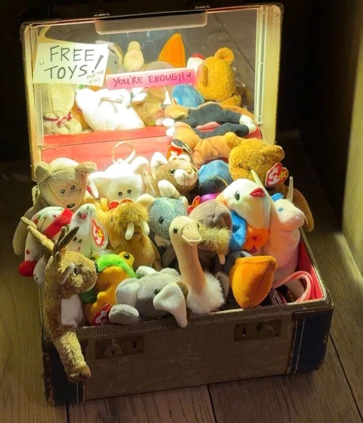 A large collection of various plush teddy bears and stuffed animals arranged together.