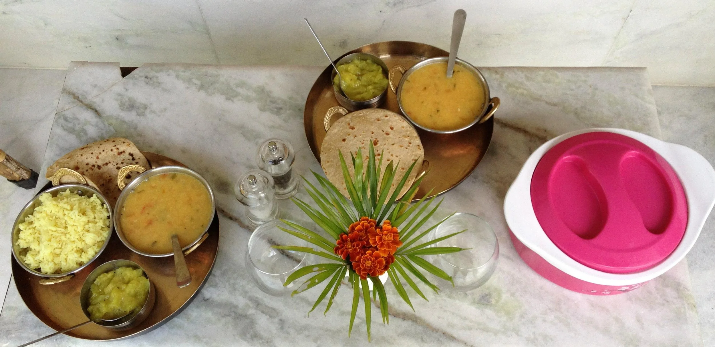 Traditional Ayurvedic Panchakarma meal with dal, roti, and fresh vegetables, supporting digestive reset and nourishment during wellness travel
