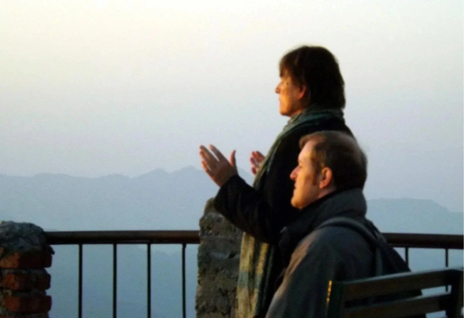 Couple embracing sunrise in the Himalayan mountains, symbolizing inner transformation, sacred travel, and spiritual awakening