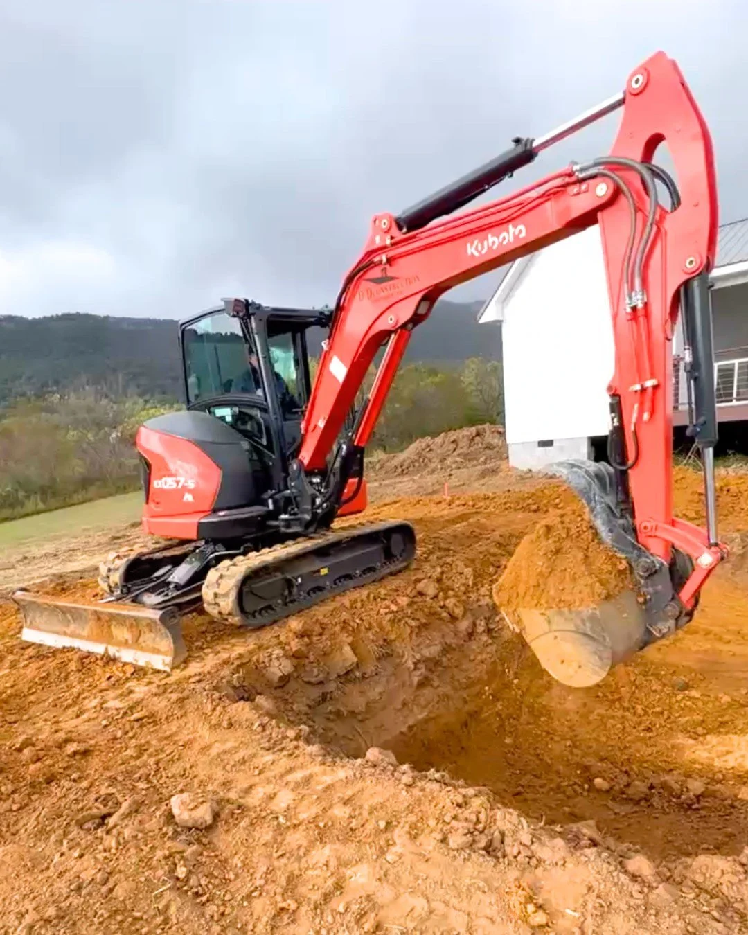 Bulldozer preparing site for a new pool