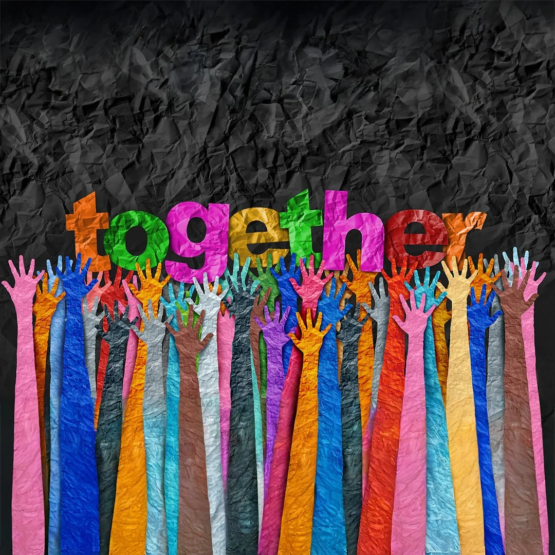 Colorful paper cutouts of hands reaching up with the word 'together' spelled out above in colorful, crumpled paper style letters.