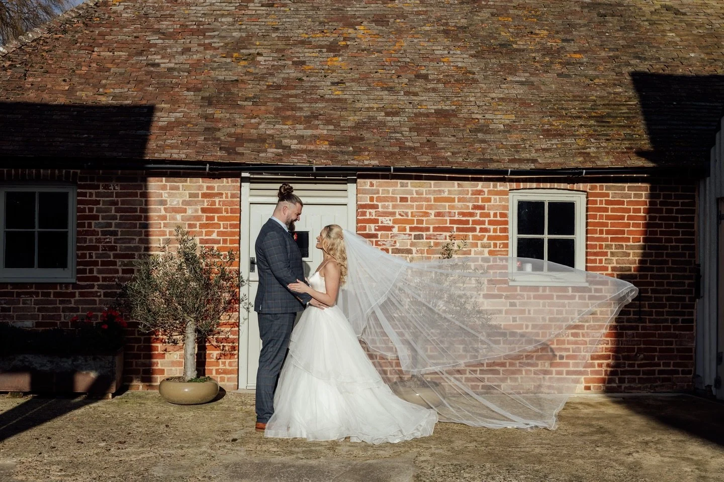 A moment for the couple and the veil 

I love a good veil shot and playing around with movement, poses, and light. And this light? It was lighting.

My favourite thing about winter is that low winter sun and how hard it hits 

@byrebarnkent 
@bridalb