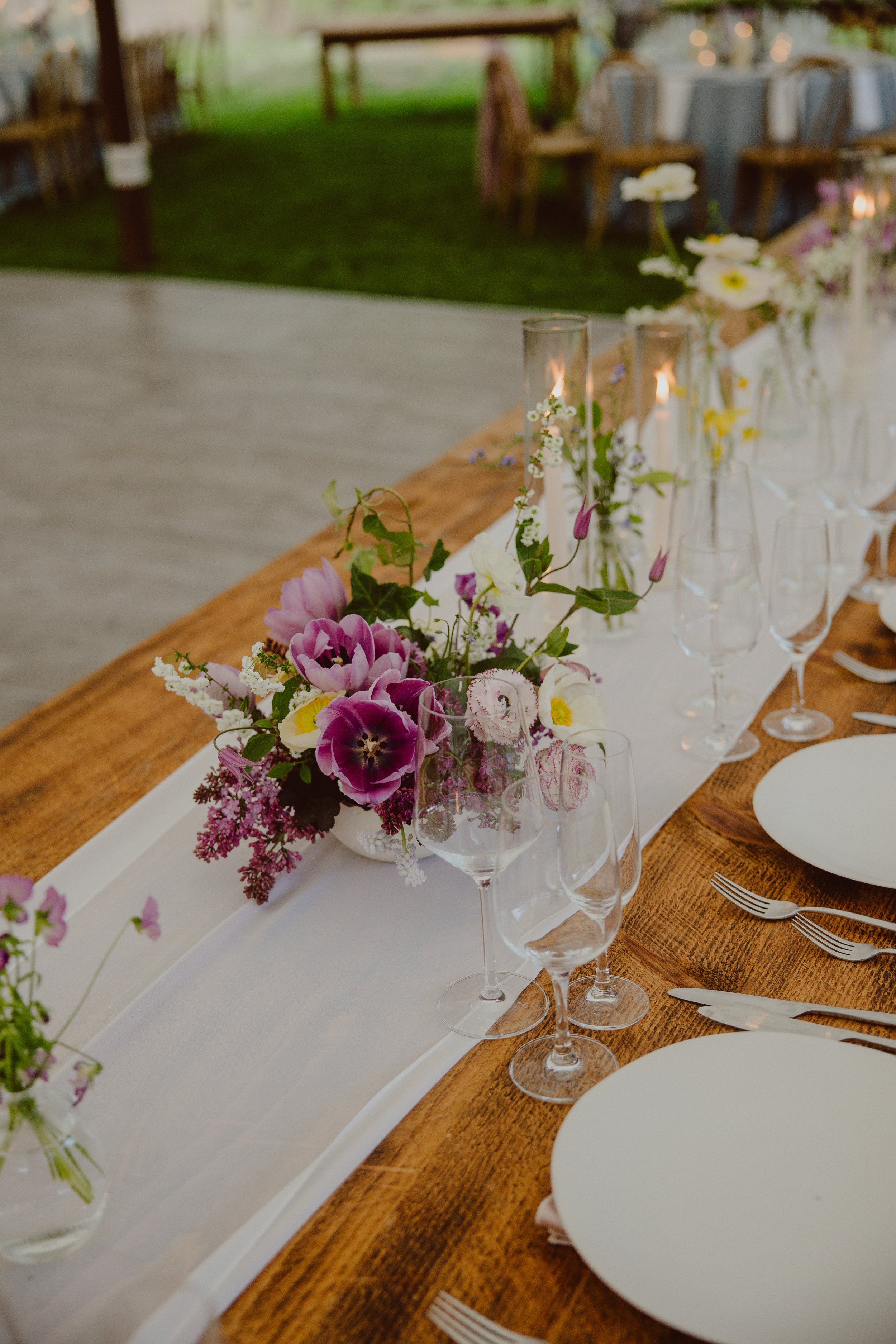 Hudson Valley wedding reception table with local spring flowers and ranunculus
