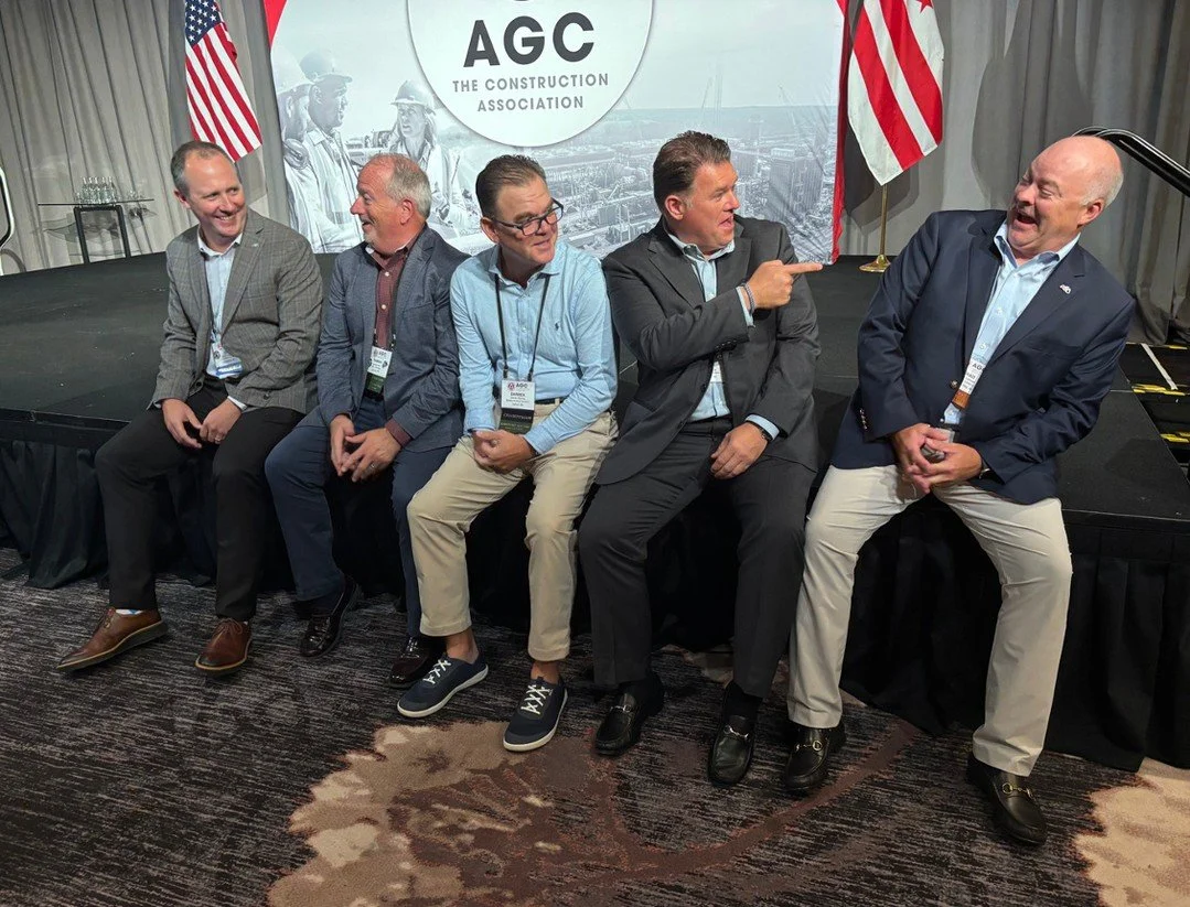 Every conference I speak at touches on AI but last month at the AGC Leadership Conference, I decided to have some fun with it.⁠
⁠
I took a picture with some Michigan friends and ran it through AI. First attempt: we ended up sitting on the laps of the