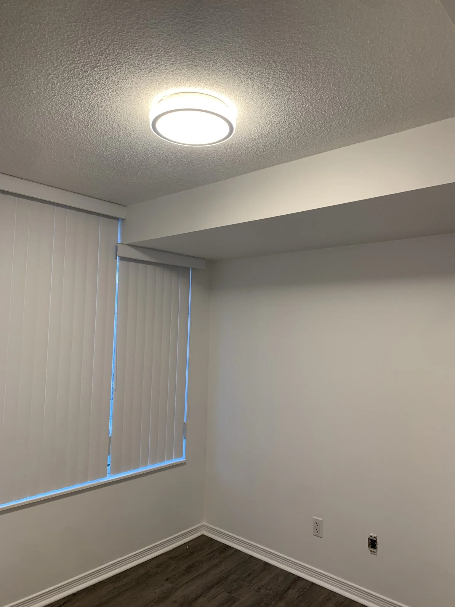 Small basement or lower-level room repainted with clean finish