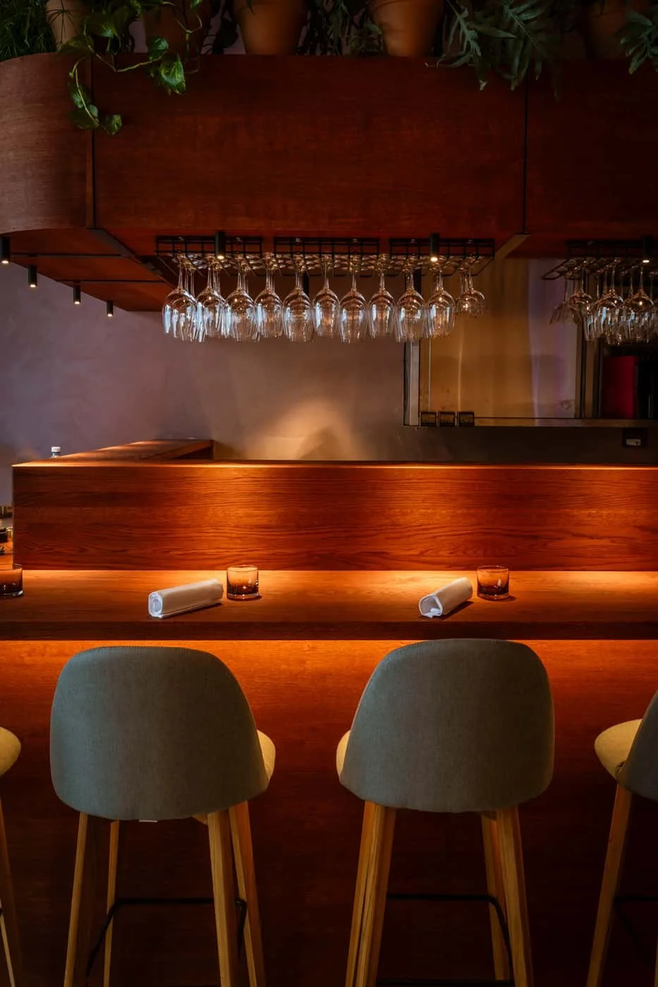 Restaurant interior at Flor Helsinki with warm lighting, wooden bar and relaxed wine bar atmosphere