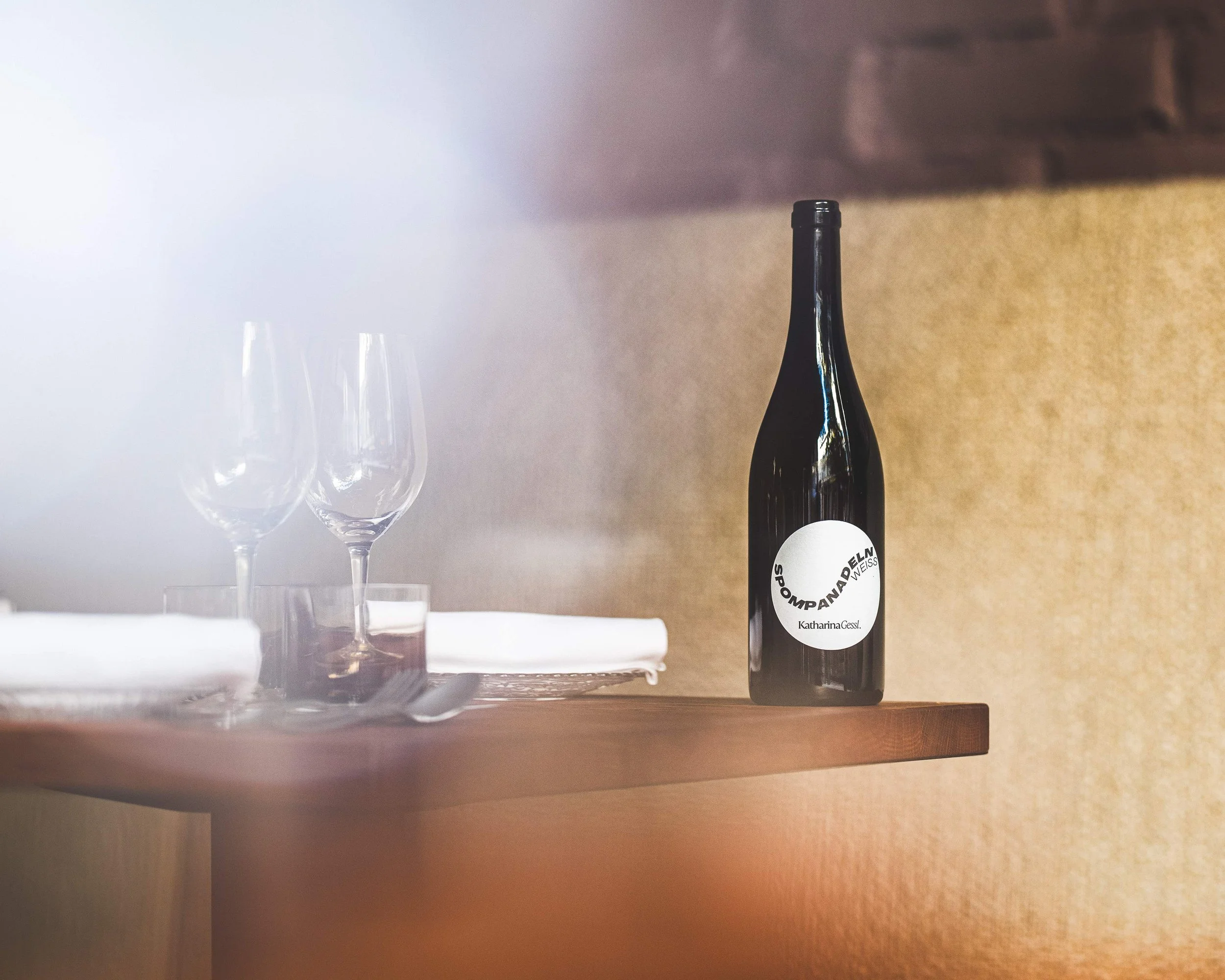 Wine bottle and glasses on table at wine bar Helsinki