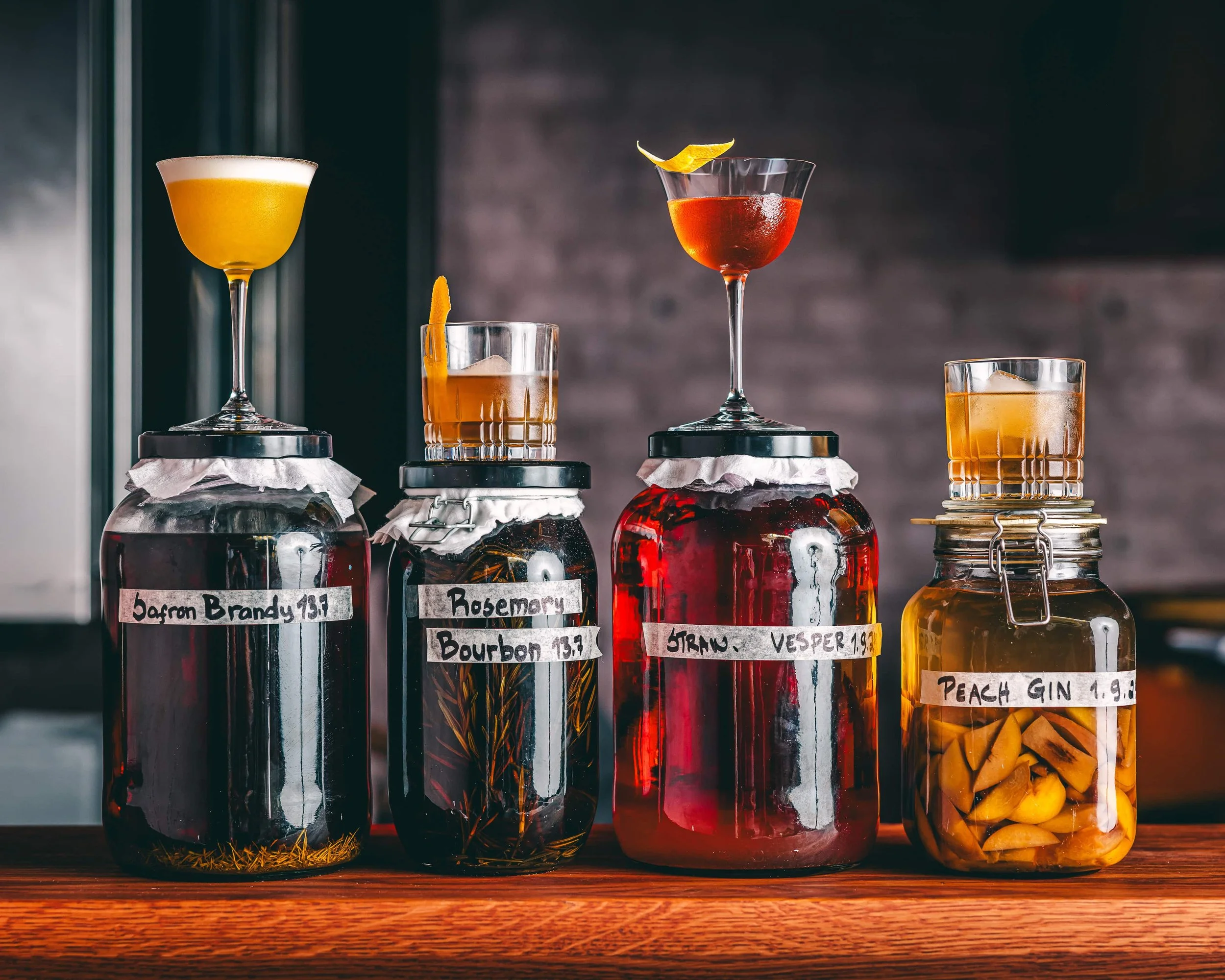 Cocktail bottles and infused spirits at wine bar Helsinki