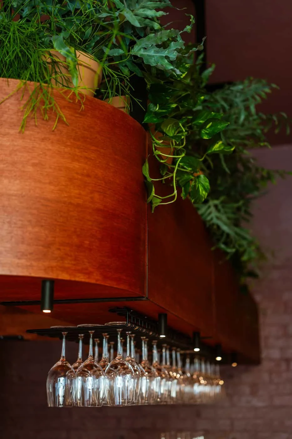 Modern restaurant space at Flor Helsinki with plants, wine glasses and Nordic interior design