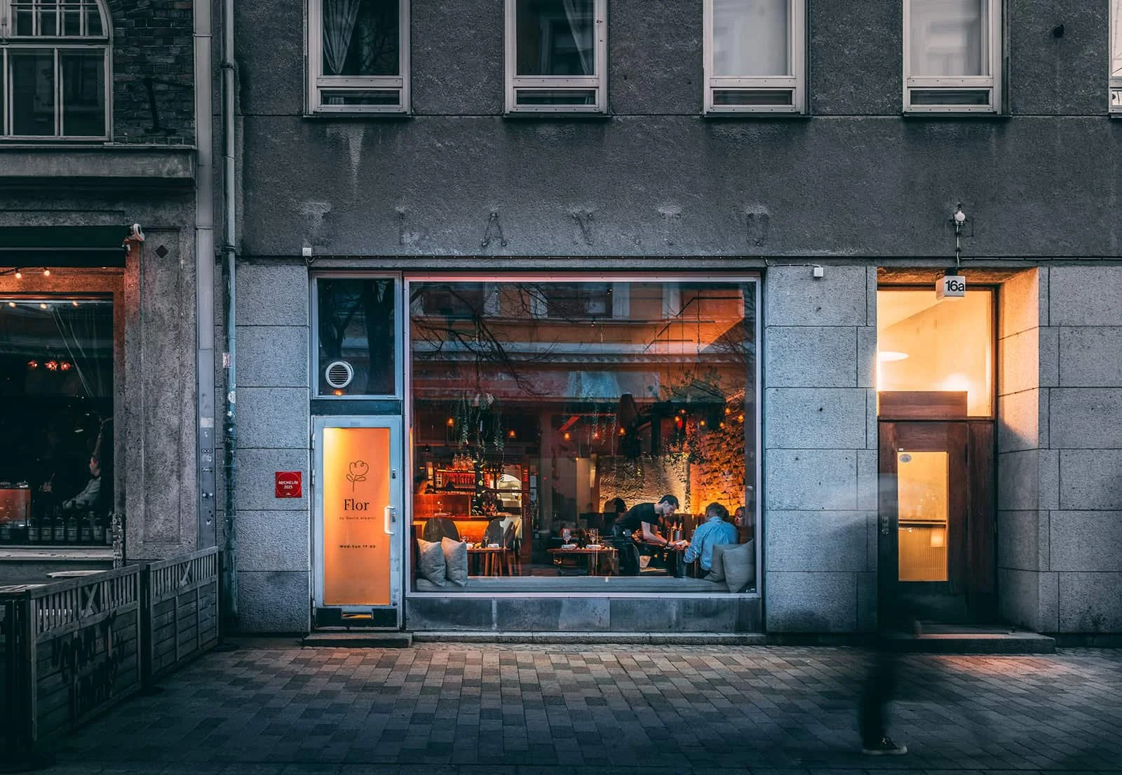 Flor Helsinki restaurant exterior in Design District with warm lighting