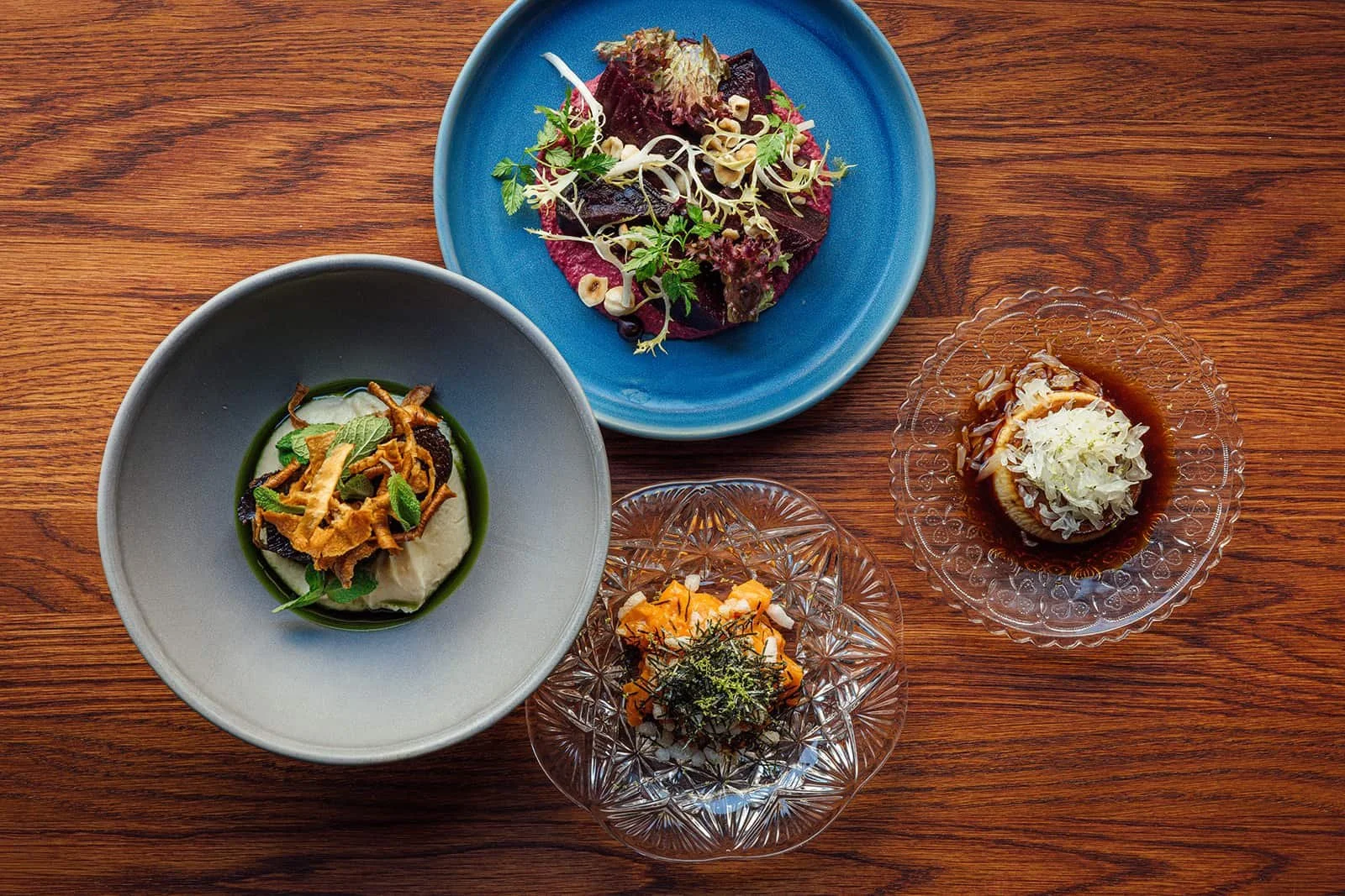 Small plates with vegetables and seafood at Helsinki restaurant