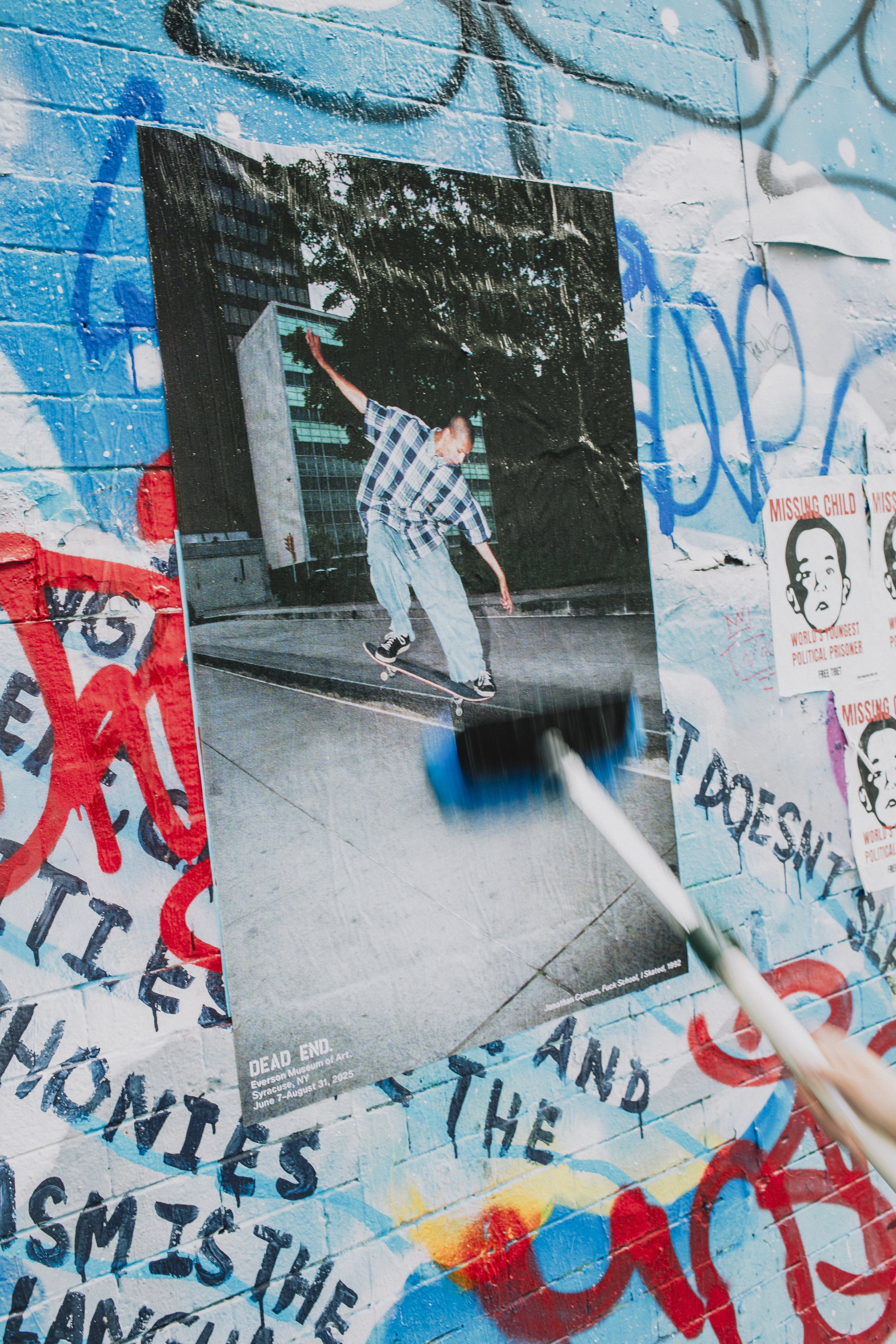 Documentation of wheatpasting by Concrete Campaigns for Dead End at Everson Museum of Art. June 2025
