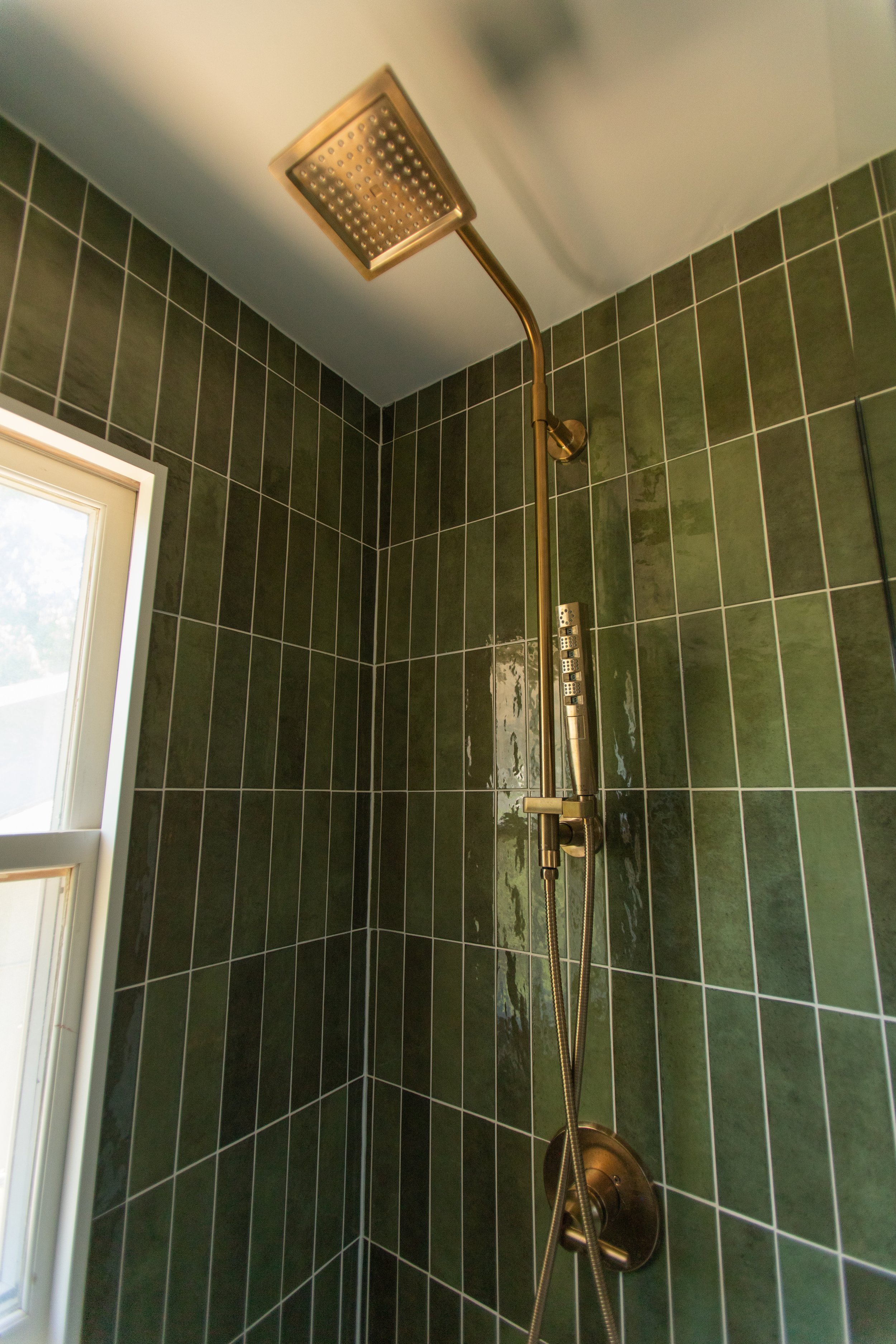 1920 Bathroom Remodel, custom wood vanity, brushed gold hardware, brushed gold sconces, modern design, mixed metal finishes, green subway tile, white hexagon floor tile, Lincoln Nebraska, professional contractors, remodeling and renovations.