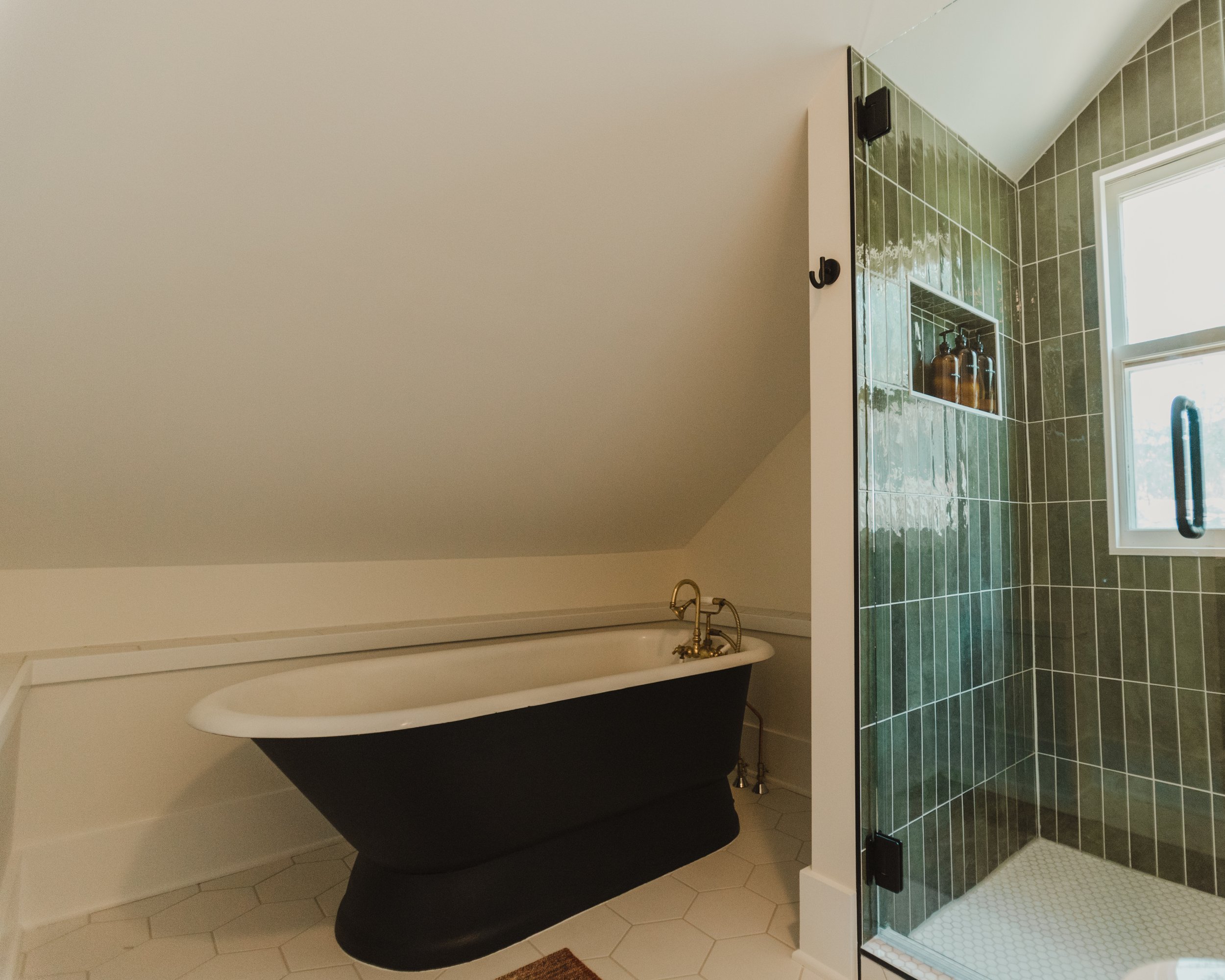 1920 Bathroom Remodel, custom wood vanity, brushed gold hardware, brushed gold sconces, modern design, mixed metal finishes, green subway tile, white hexagon floor tile, Lincoln Nebraska, professional contractors, remodeling and renovations.