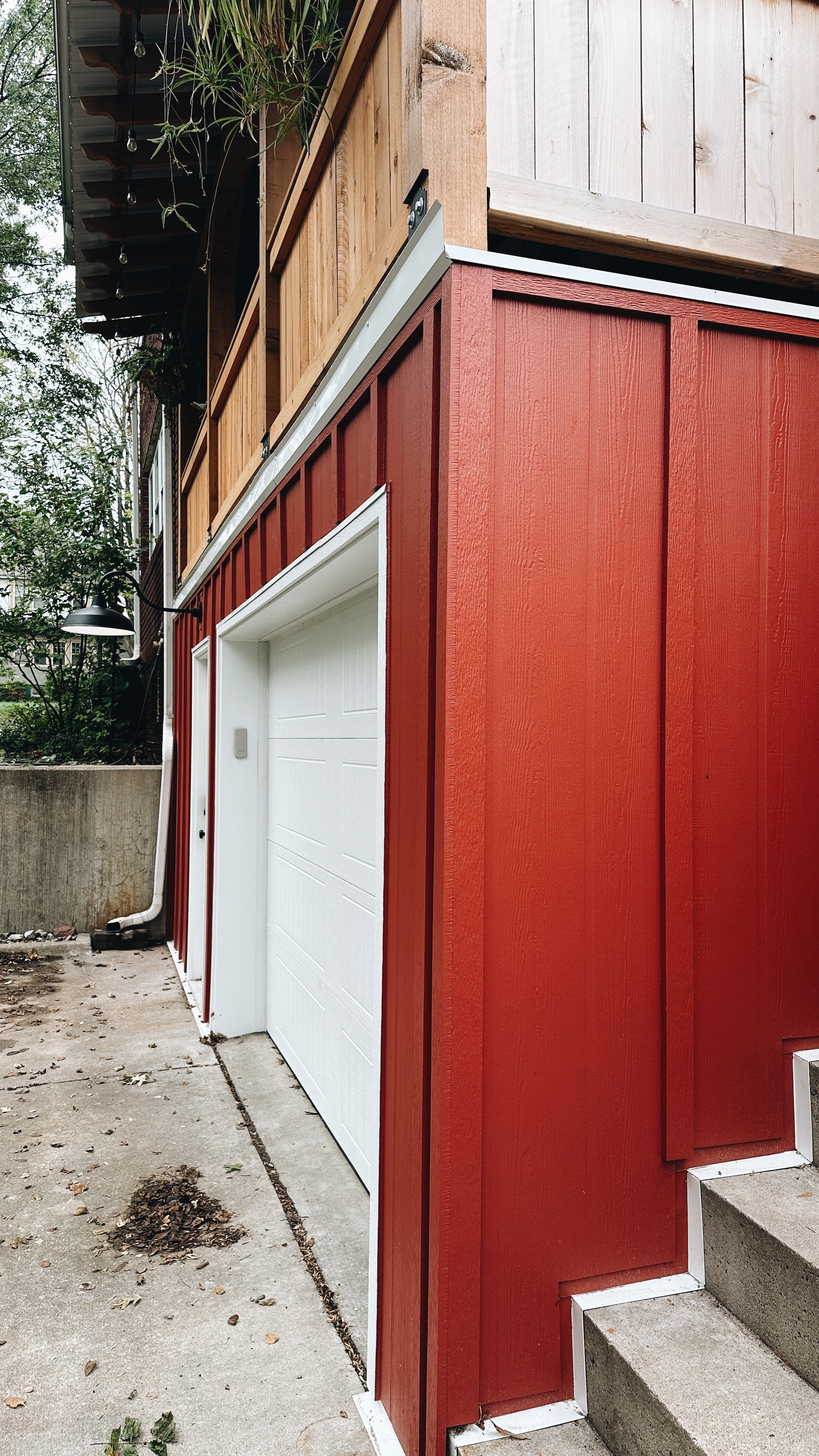 1923 Garage Remodel, Lincoln Nebraska, professional contractors, craftsmanship, red wood siding, matte black light fixture.