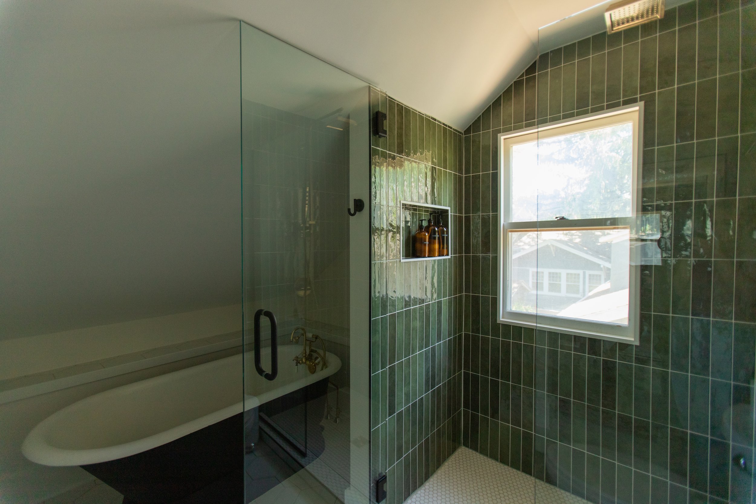 1920 Bathroom Remodel, custom wood vanity, brushed gold hardware, brushed gold sconces, modern design, mixed metal finishes, green subway tile, white hexagon floor tile, Lincoln Nebraska, professional contractors, remodeling and renovations.