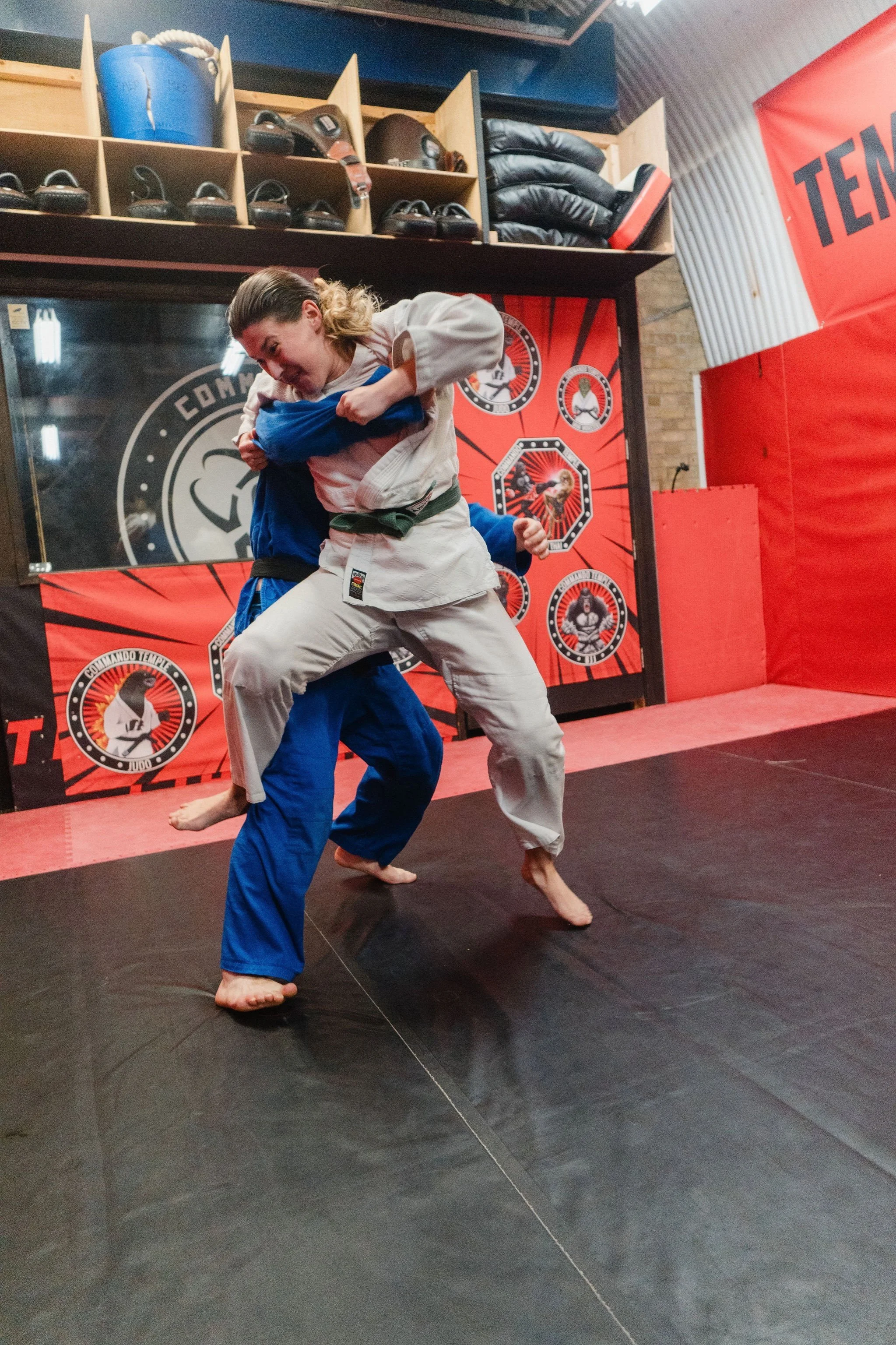 female judo fighter against a judo black belt. training at our Deptford Dojo. Personal training and small group sessions to improve fitness and strength