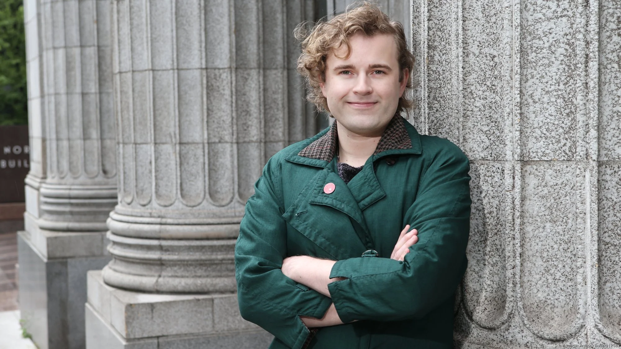 Ry Armstrong standing in a green jacket