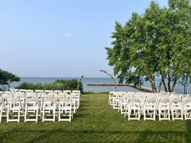 outside ceremony white chairs.jpeg