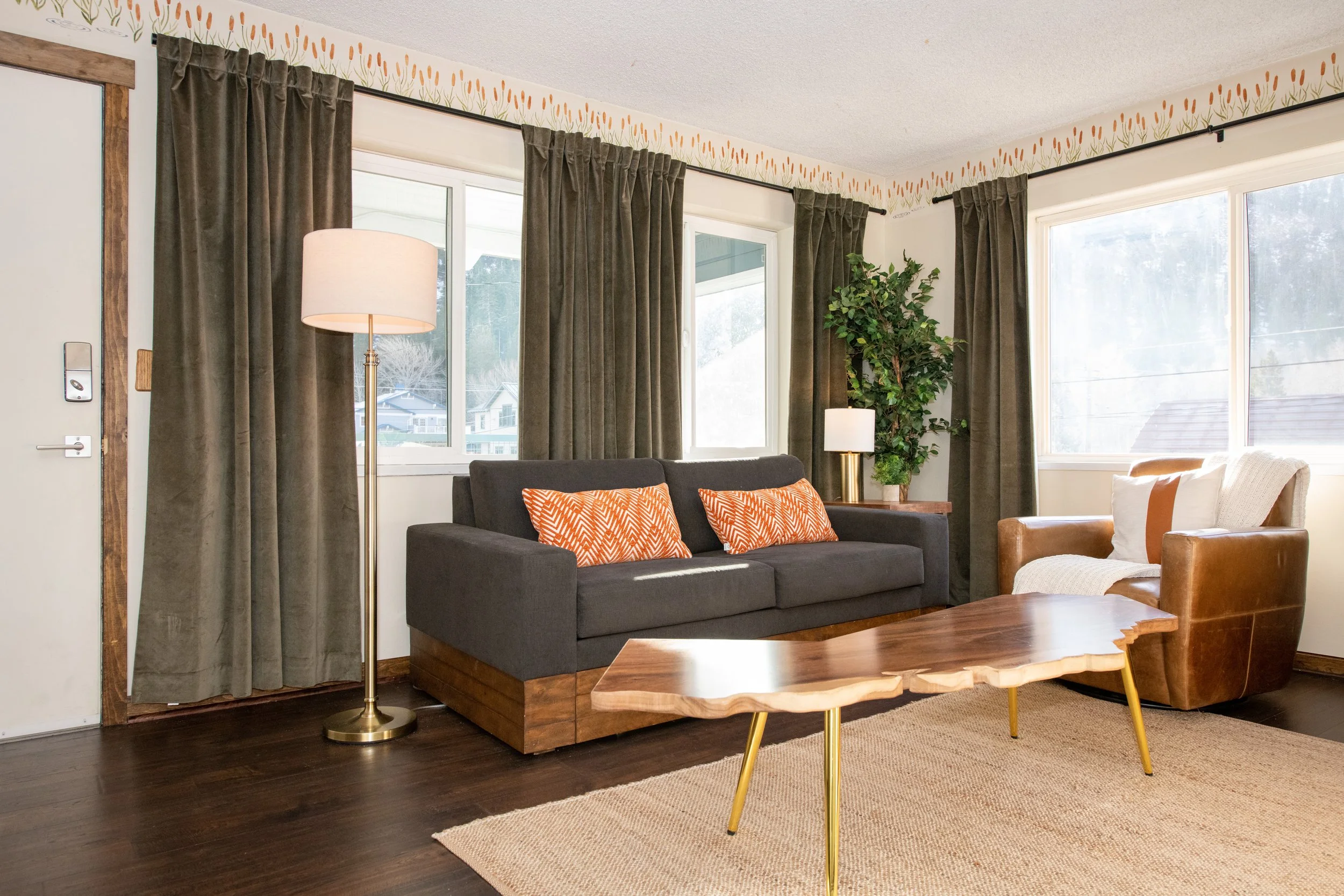 Cozy motel room interior with full kitchen and dining area at Gull Lake Lodge