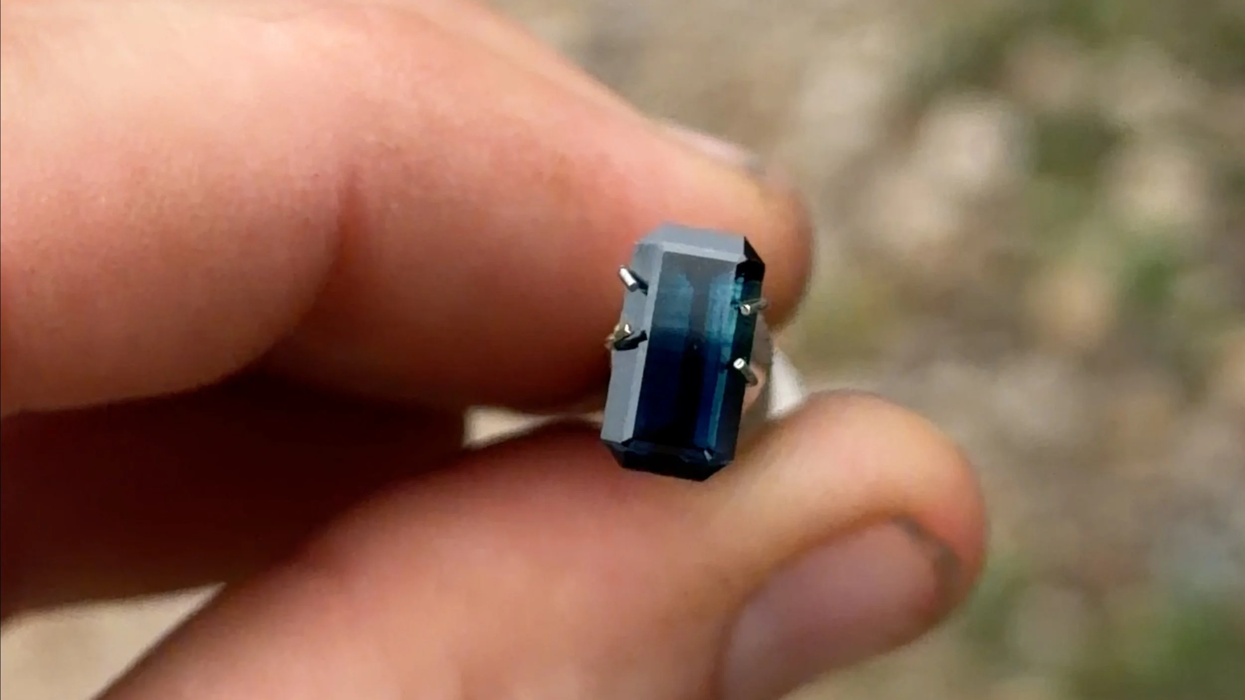 2.2 ct dark blue emerald cut sapphire