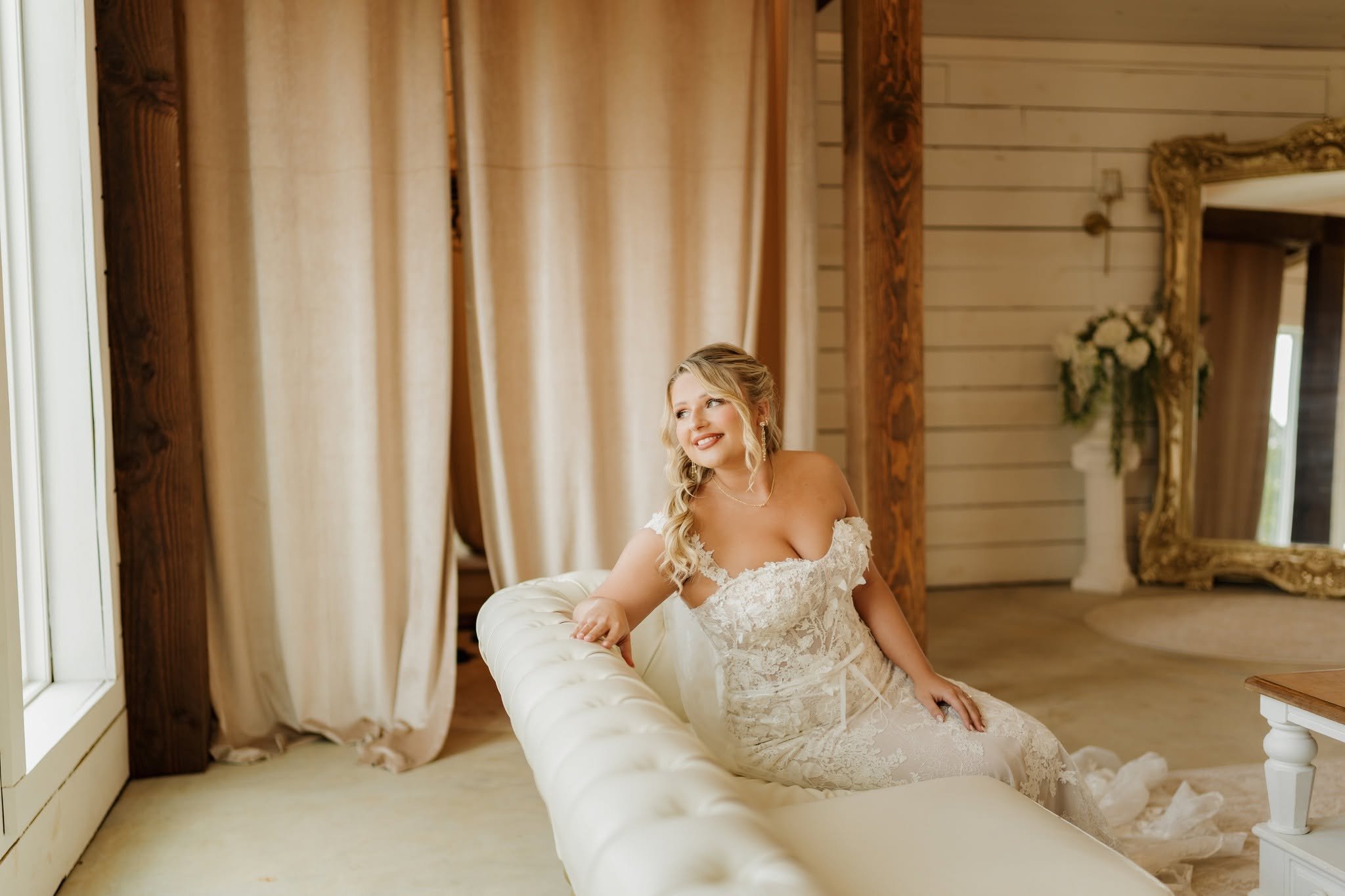 bride on couch in bridal suite mirror too rylee.jpg