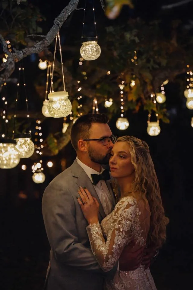 Bride and groom portrait under lantern lights at Berkshire Ridge Wedding Venue near St. Louis Missouri