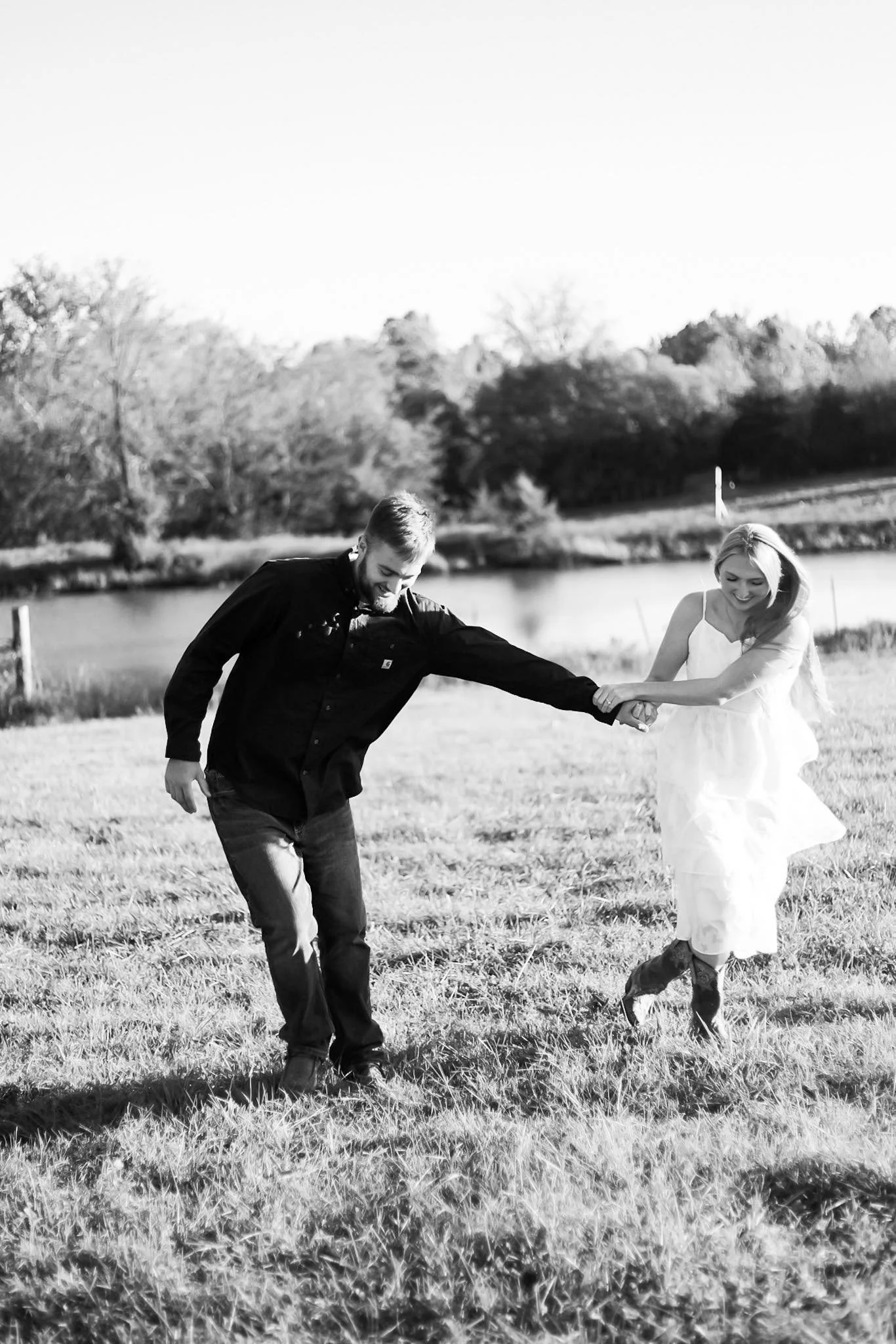 engagement photo in field of this st louis wedding venue.jpg