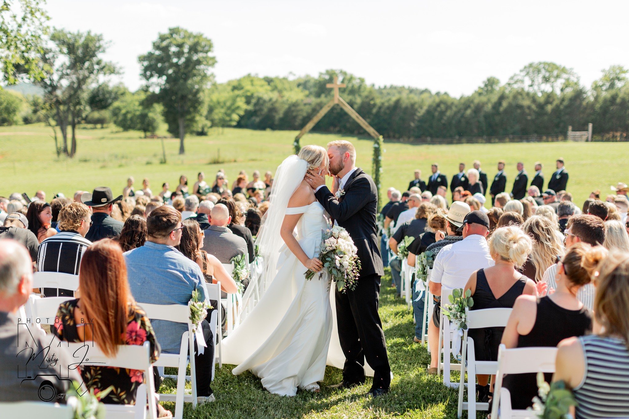 ceremony kiss in field Cami Zach Berkshire Ridge.jpg