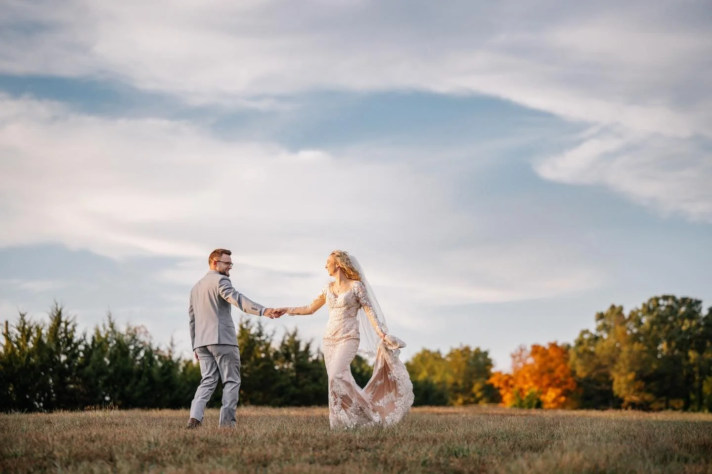 Couple in a wide open field wedding photo