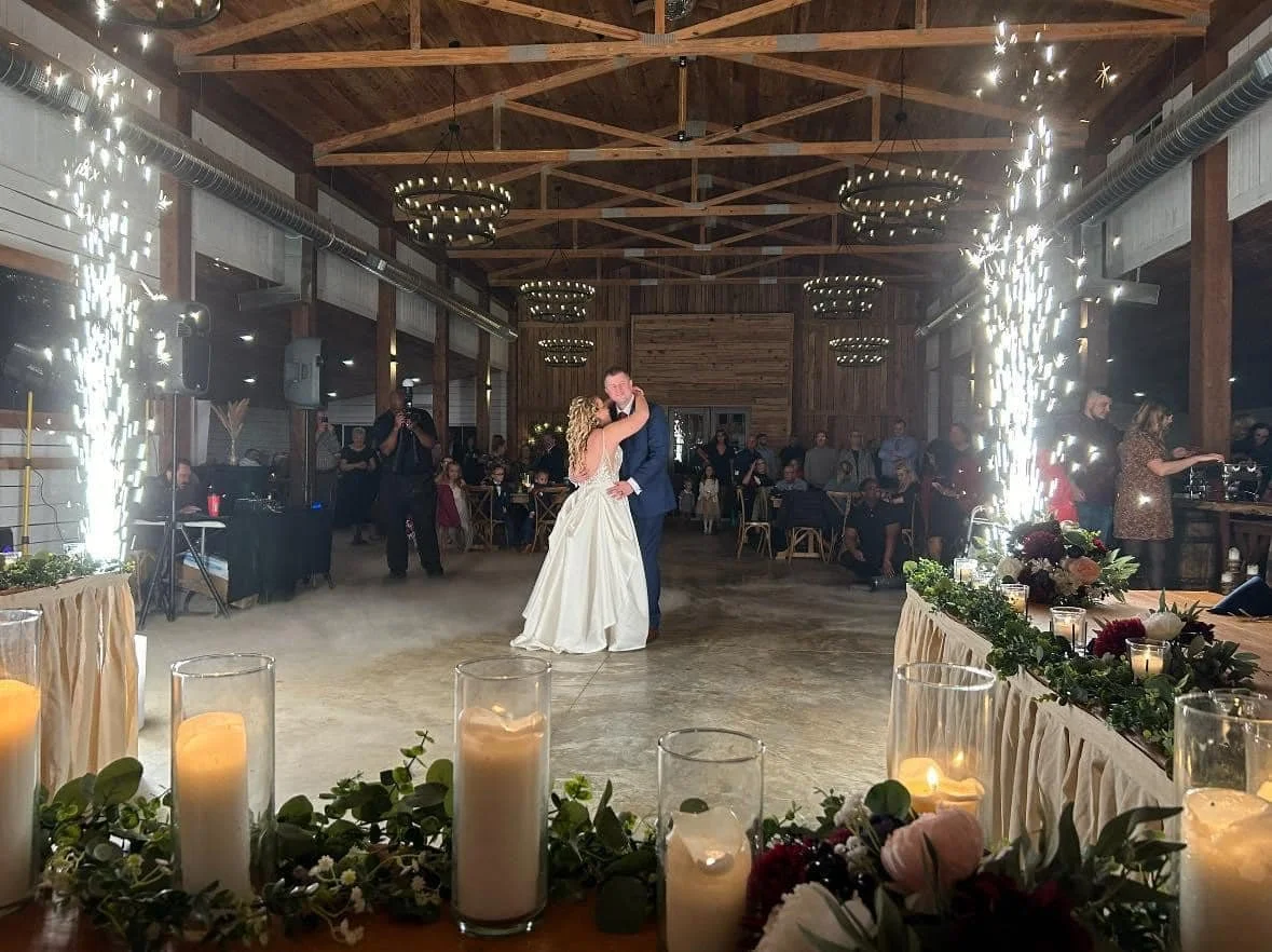 Berkshire Ridge, a wedding venue within an hour of St. Louis,  bride and groom dance with clouds and sparklers all around them.