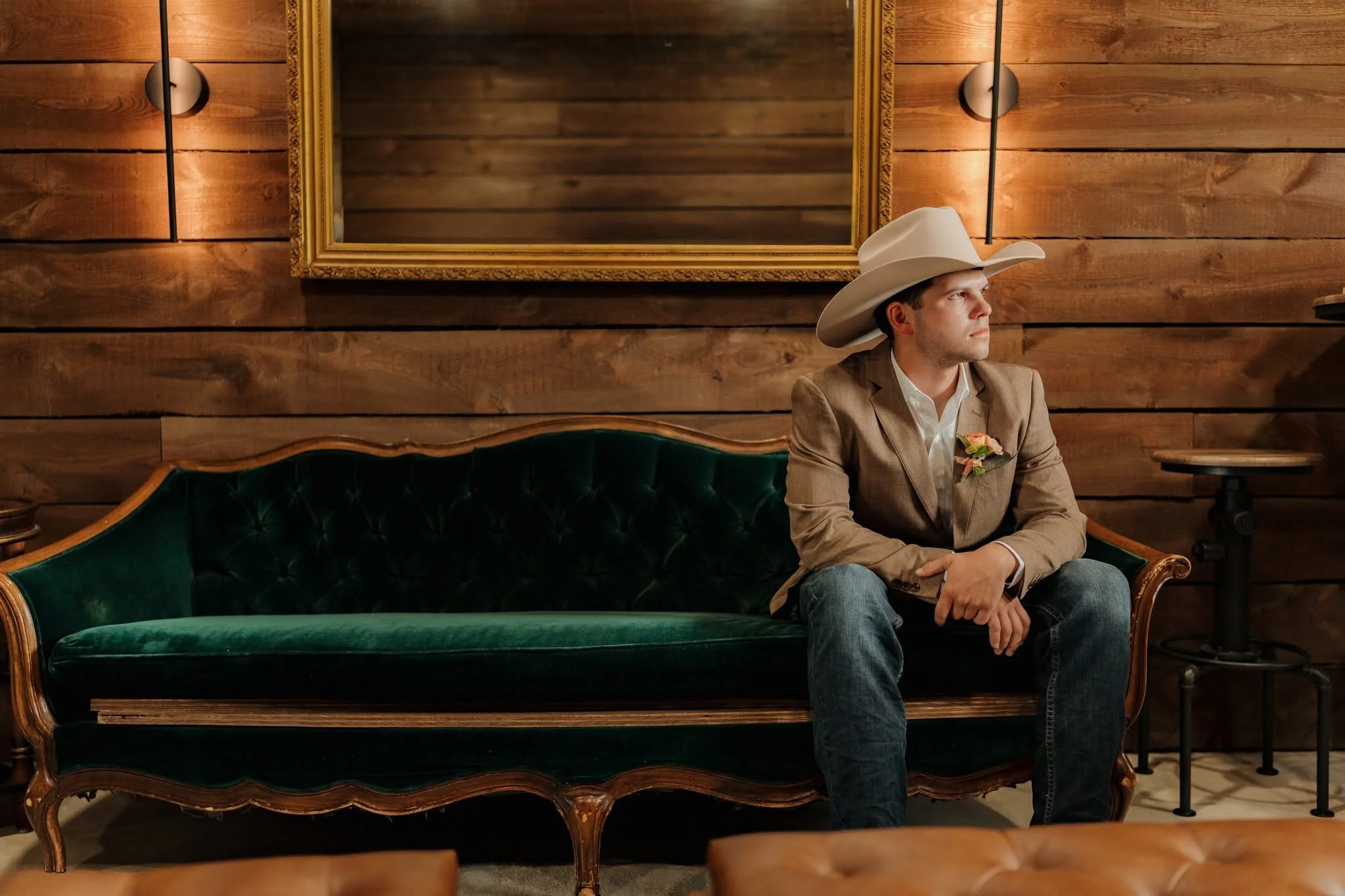 groom suite grant on green couch.jpg