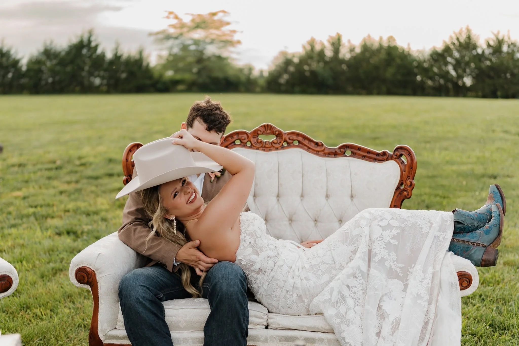 outdoor couch in green pasture wedding venue.jpg