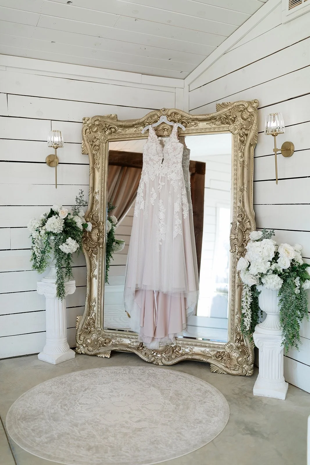 wedding dress on the large mirror in bridal suite.jpg