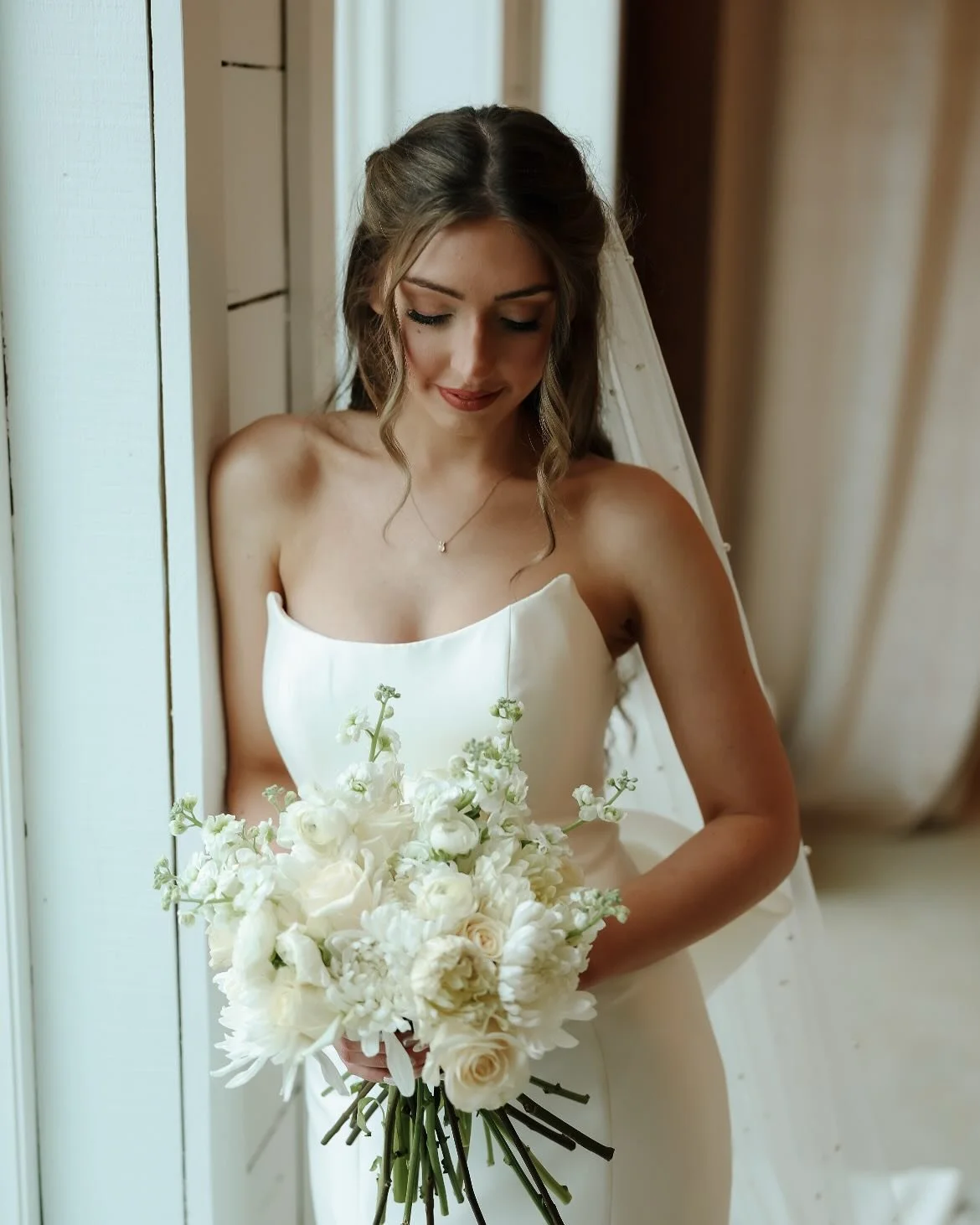 Abby in bridal suite by window.jpg