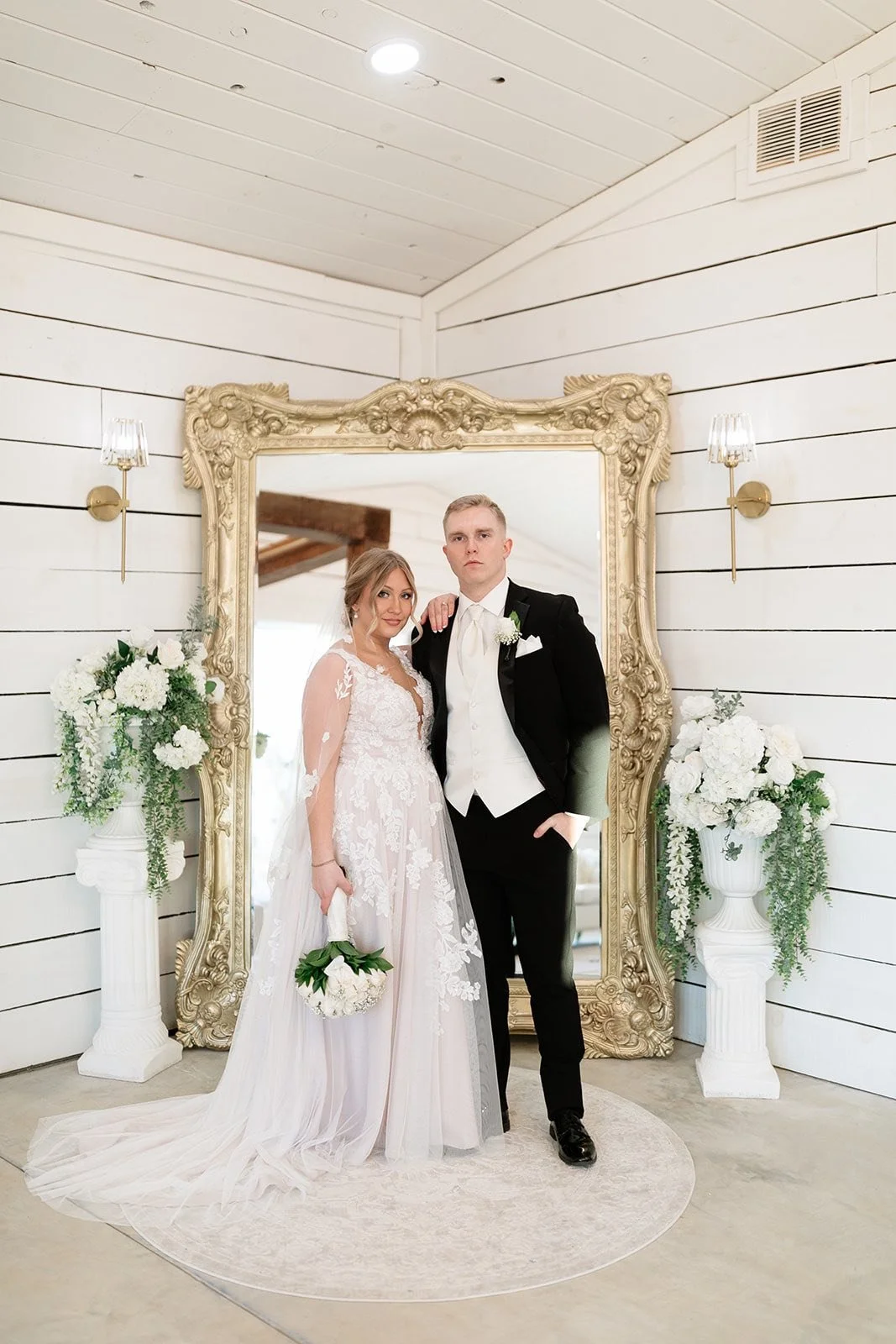 couple in front of the bridal suite huge mirror.jpg