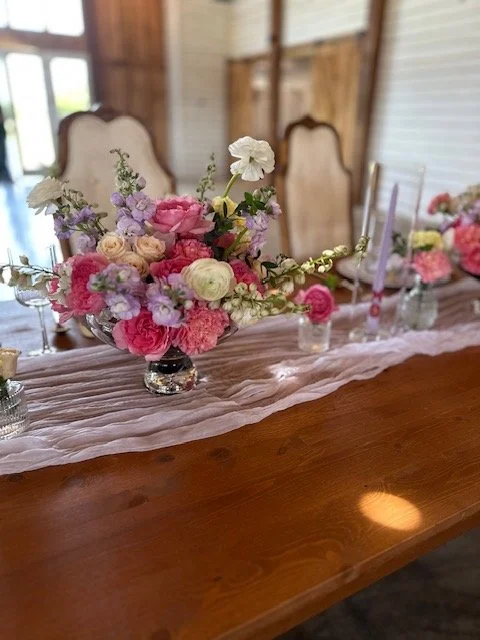 bright flowers floral arrangements at a wedding head table